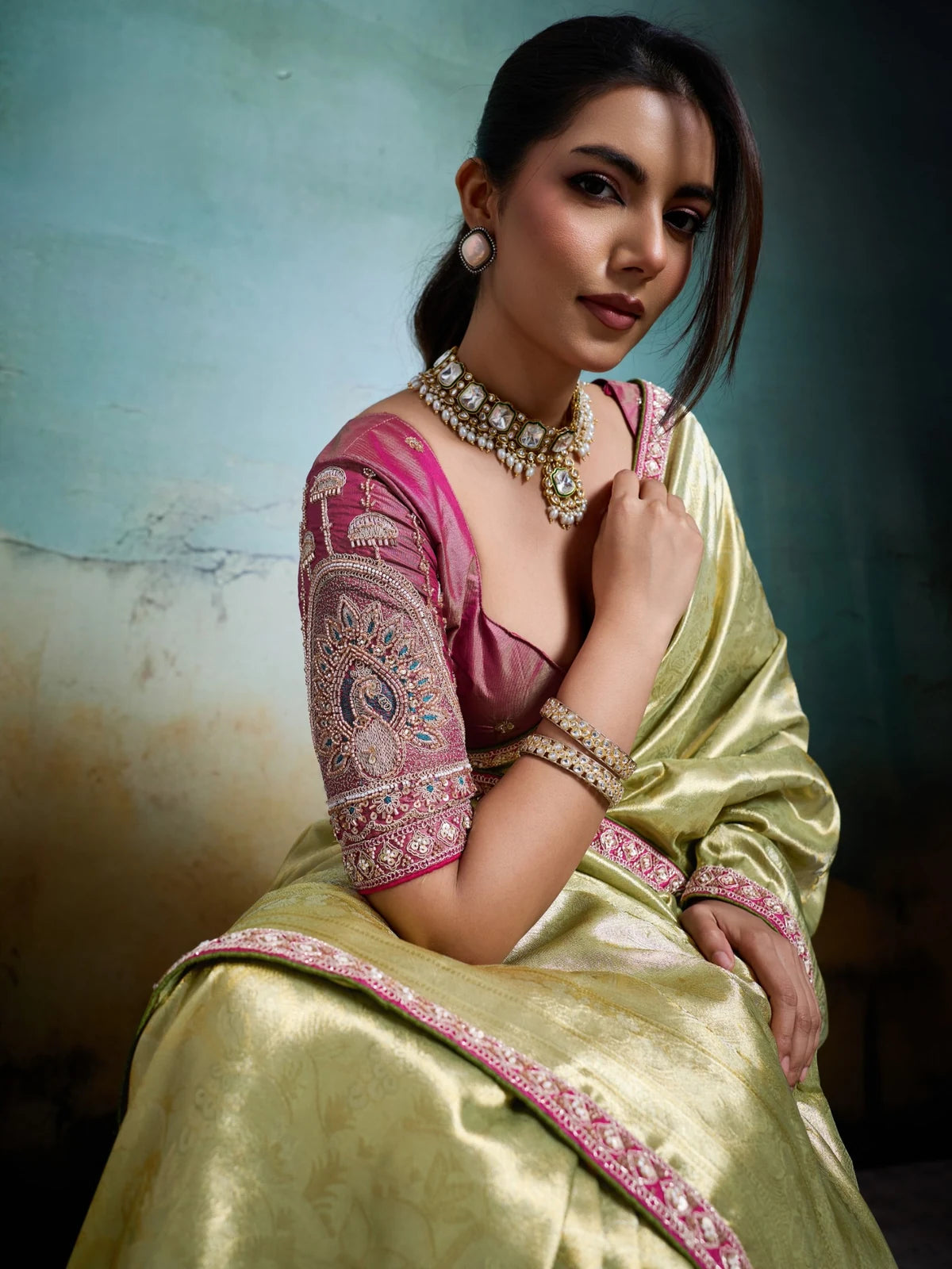 Tarani green Banarasi saree closeup with heavy sleeve work blouse and cutdana detailing