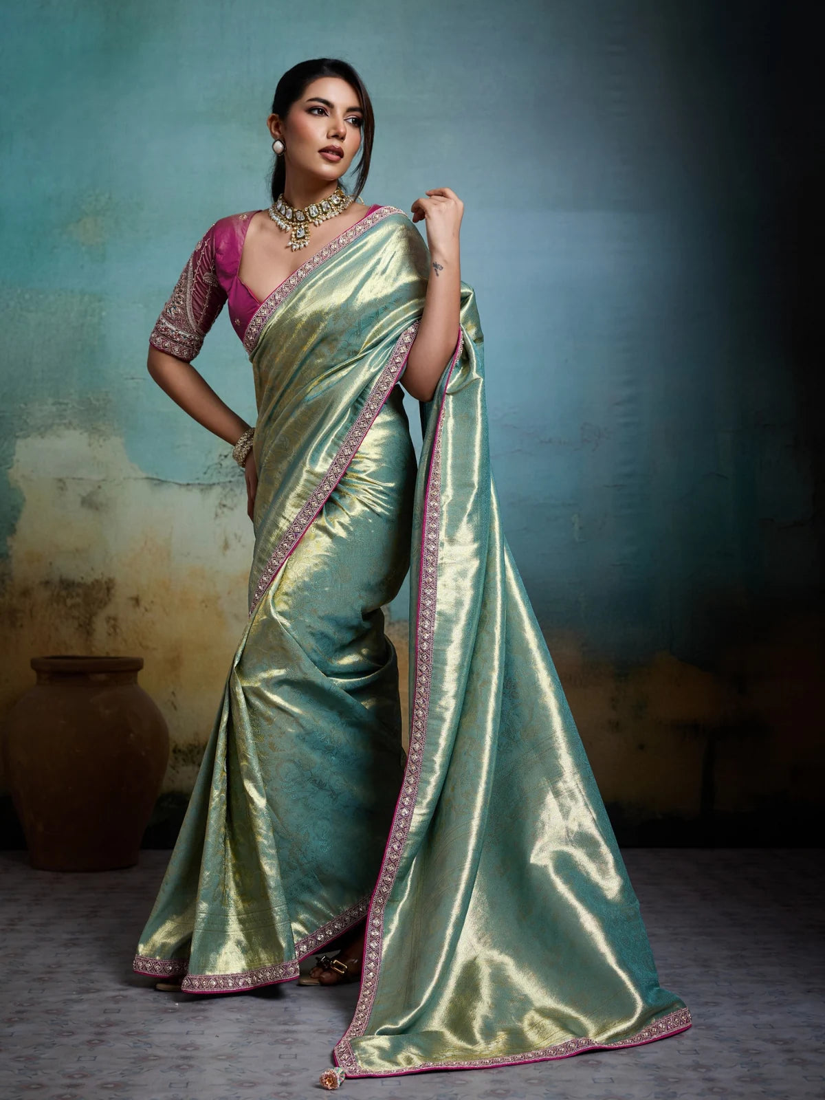 Tarani green Banarasi saree front view with handcrafted border and tassels