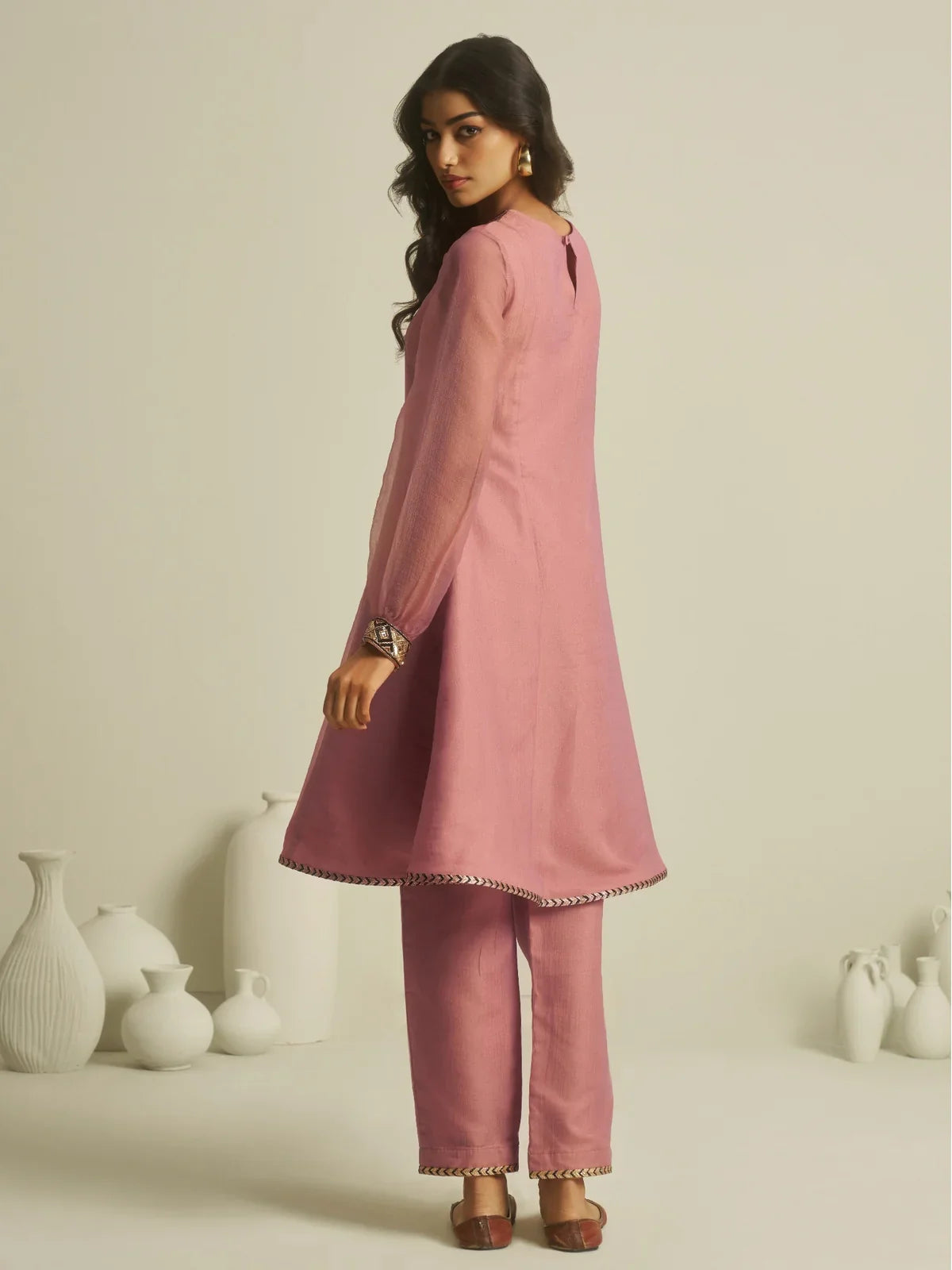 Tarani pink tissue festive dress with elegant handwork in back view