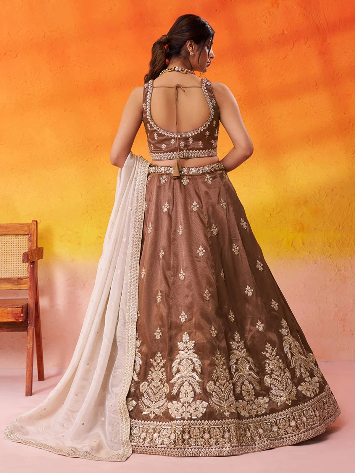 Tarani back view of tissue lehenga blouse with stylish tie-up and dupatta