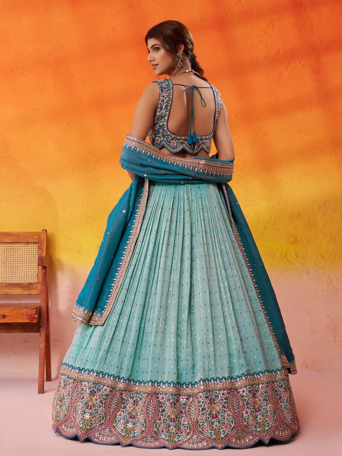 Tarani green lehenga blouse back view with dori design and elegant finish