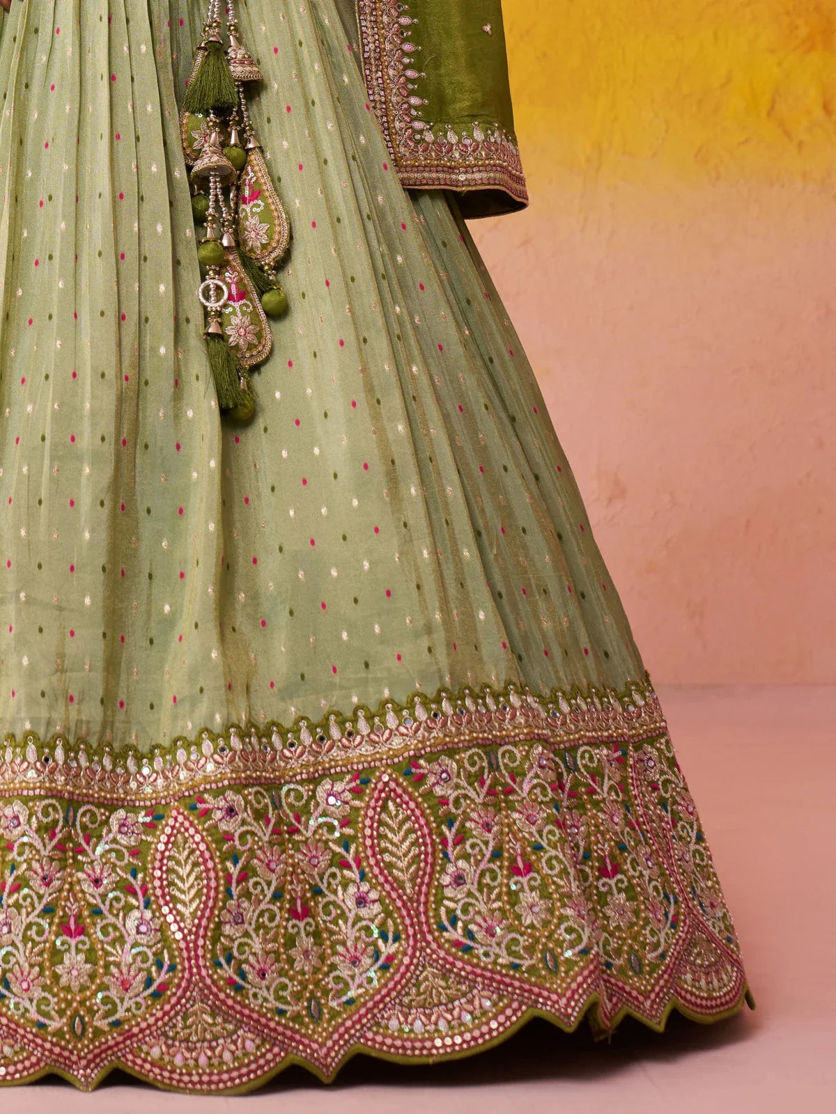 Tarani green jacquard tissue lehenga closeup showing fine embroidery, border work and fabric texture