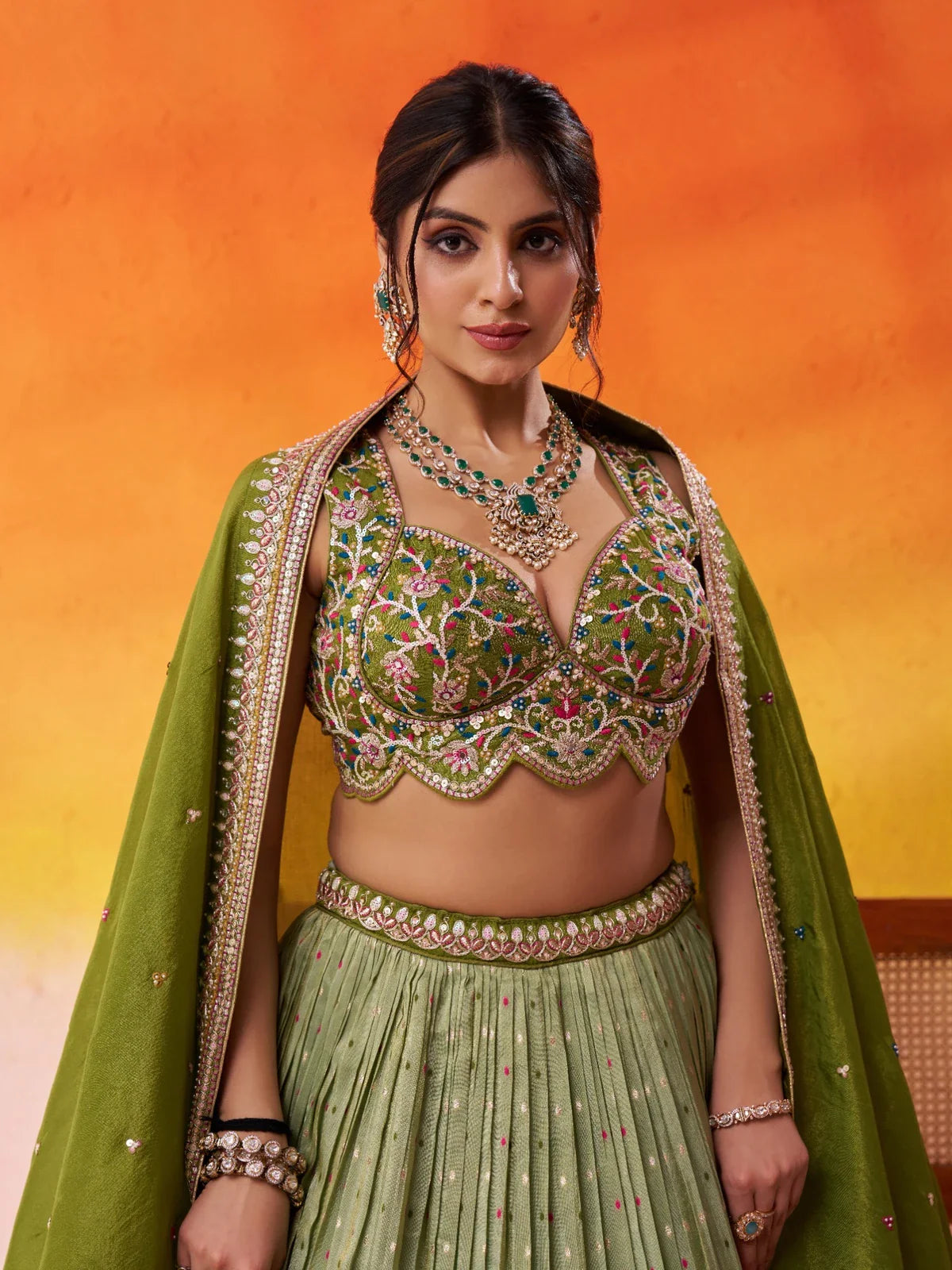 Tarani green jacquard tissue lehenga upper body view showing detailed embroidered blouse and neckline