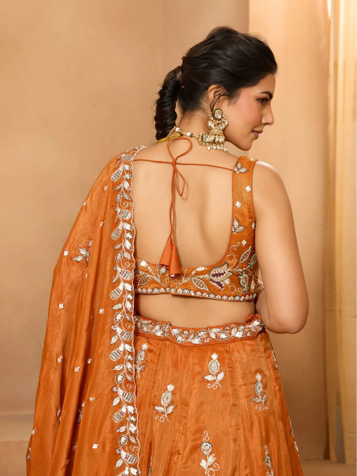 Tarani designer orange tissue lehenga with detailed back blouse embroidery view