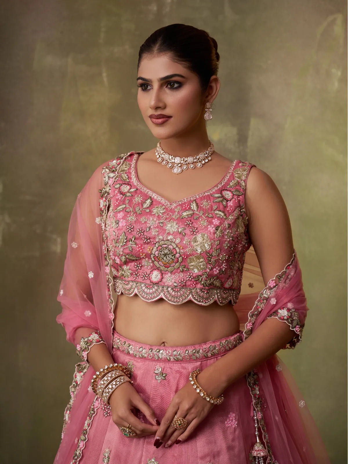 Tarani close-up of embroidered blouse with pink tissue lehenga and dupatta