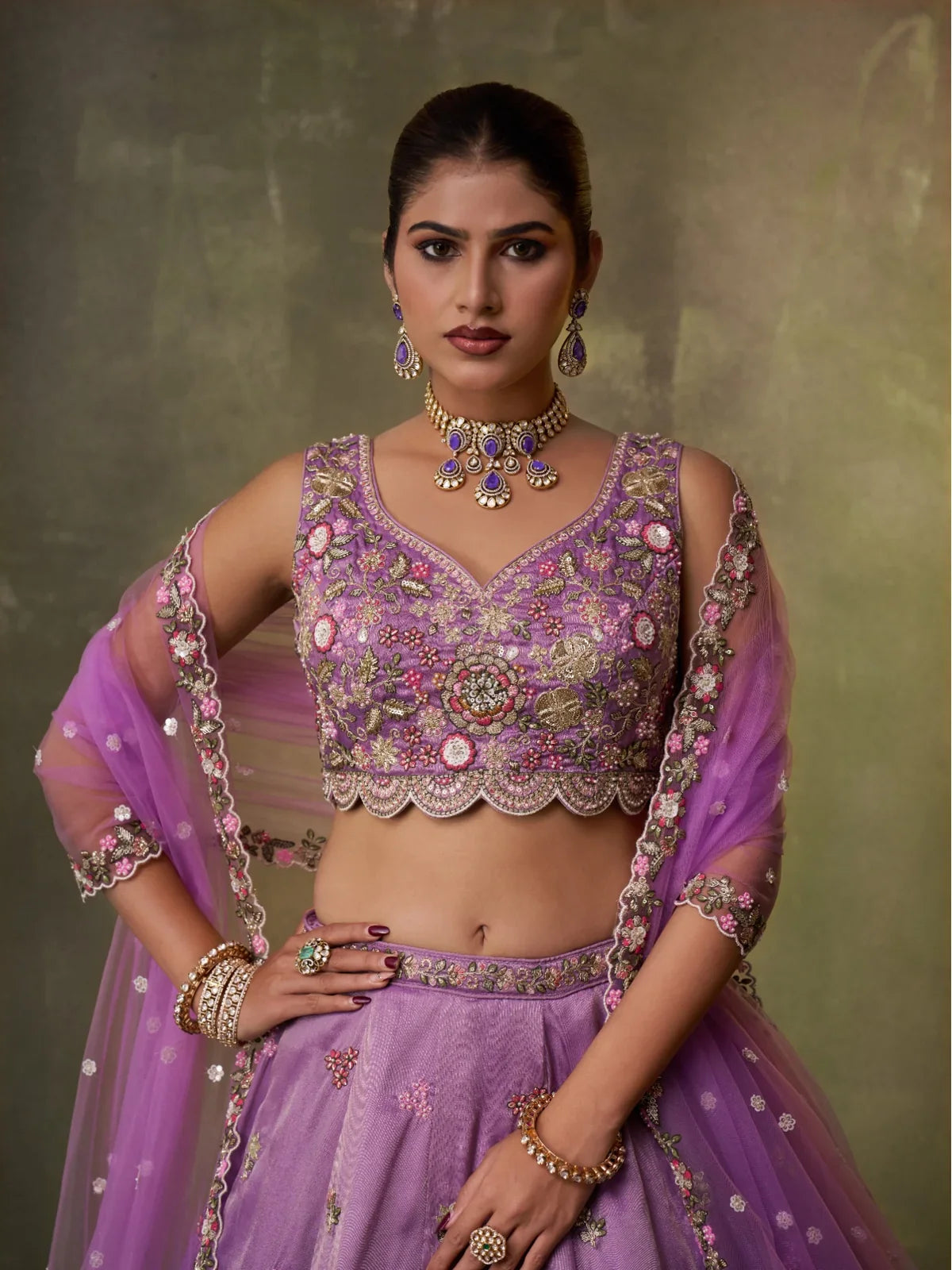 Tarani purple tissue lehenga blouse upper body close-up with rich embroidery and sheer dupatta