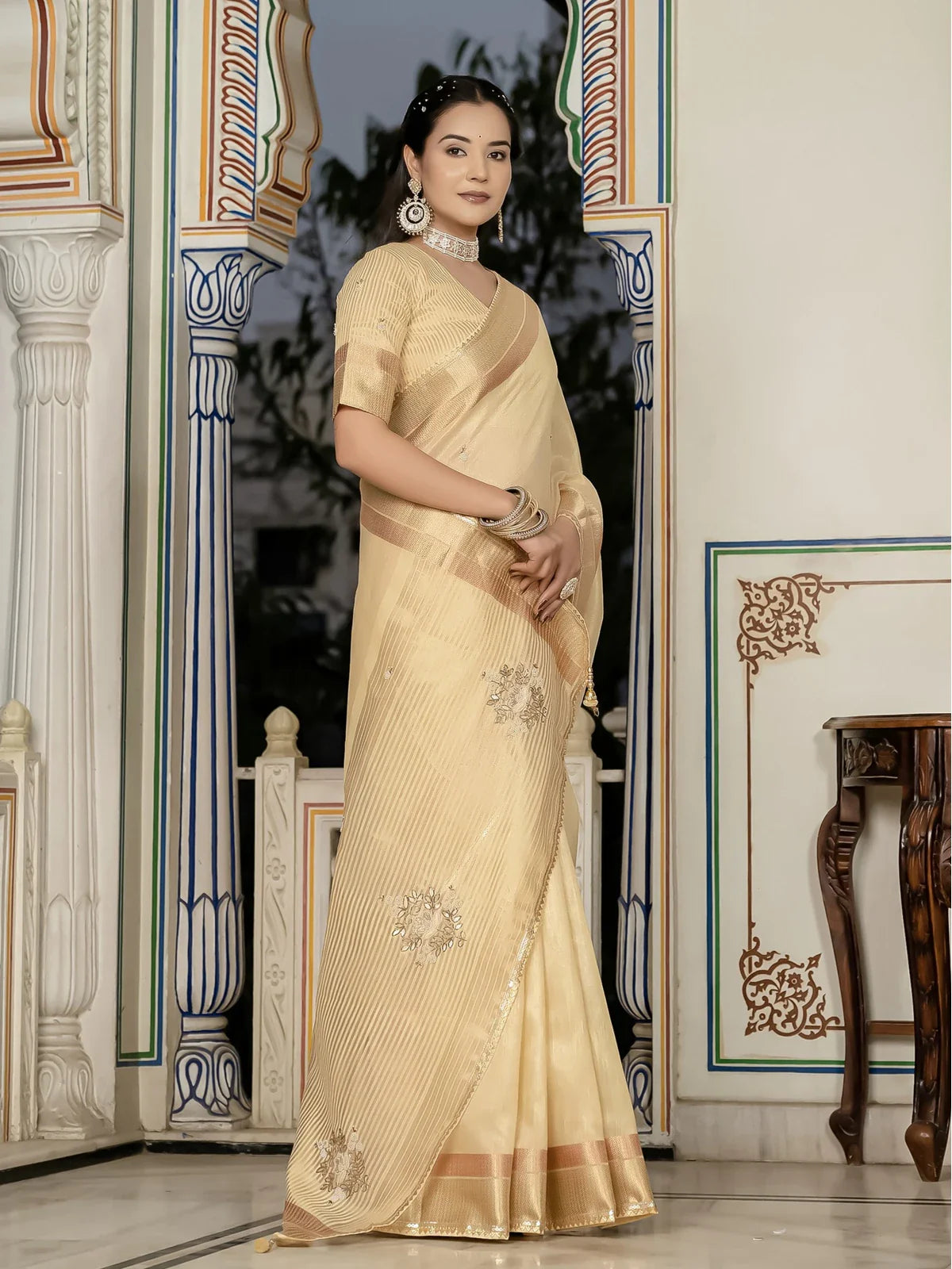 Tarani beige tissue linen saree side view showing graceful drape