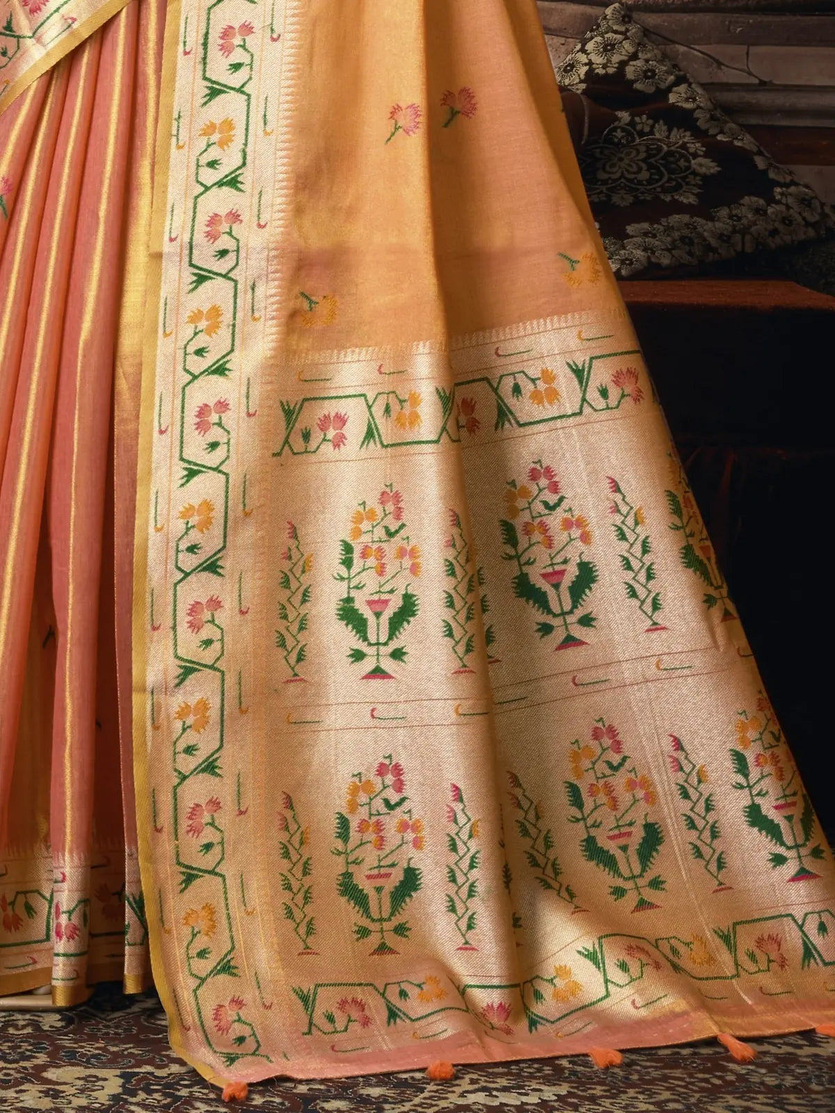 Tarani peach tissue silk Paithani pallu close view with floral woven border and tassels