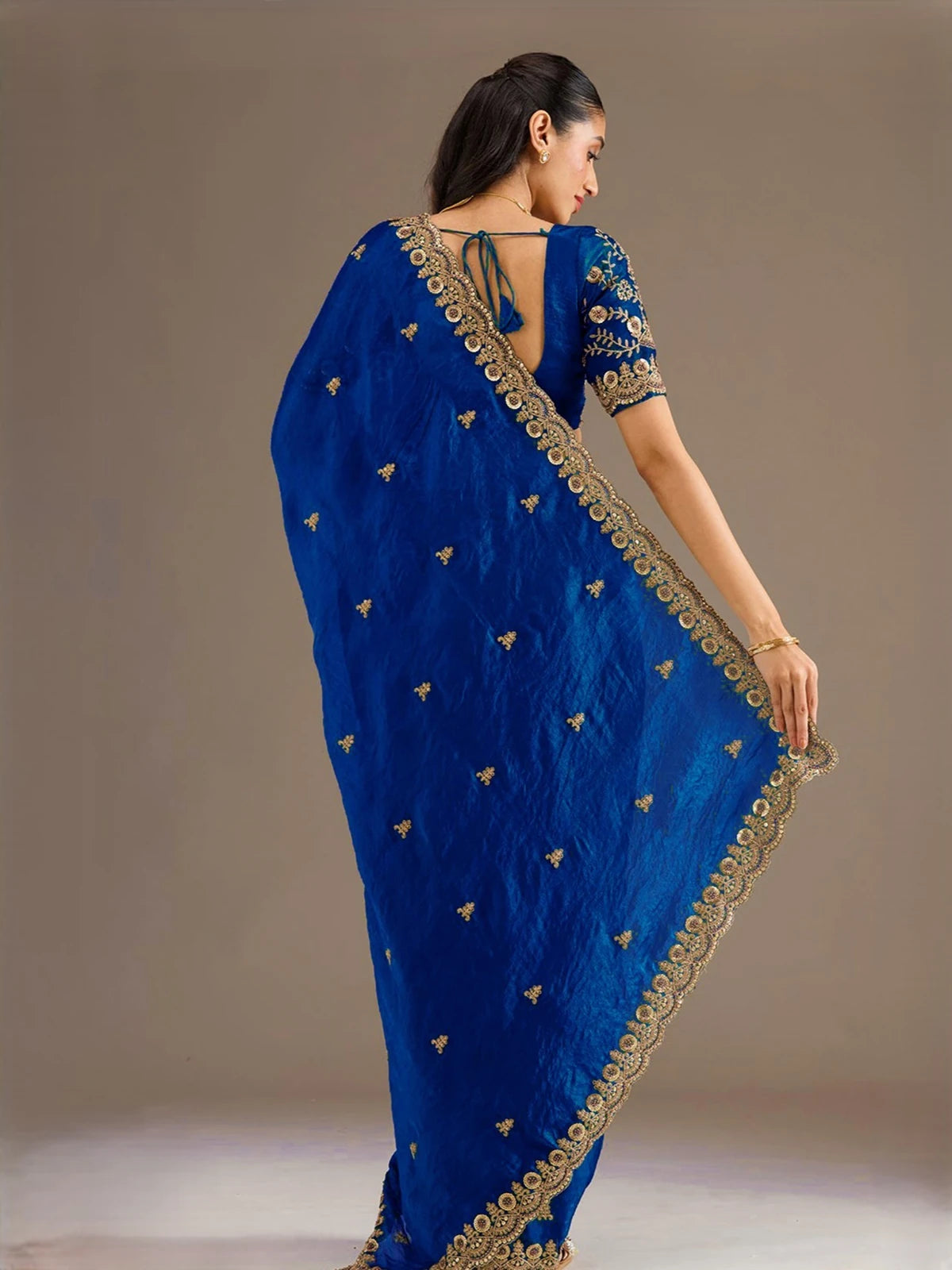 Tarani Sagarika royal blue tissue saree back view showcasing pallu and embroidered blouse design