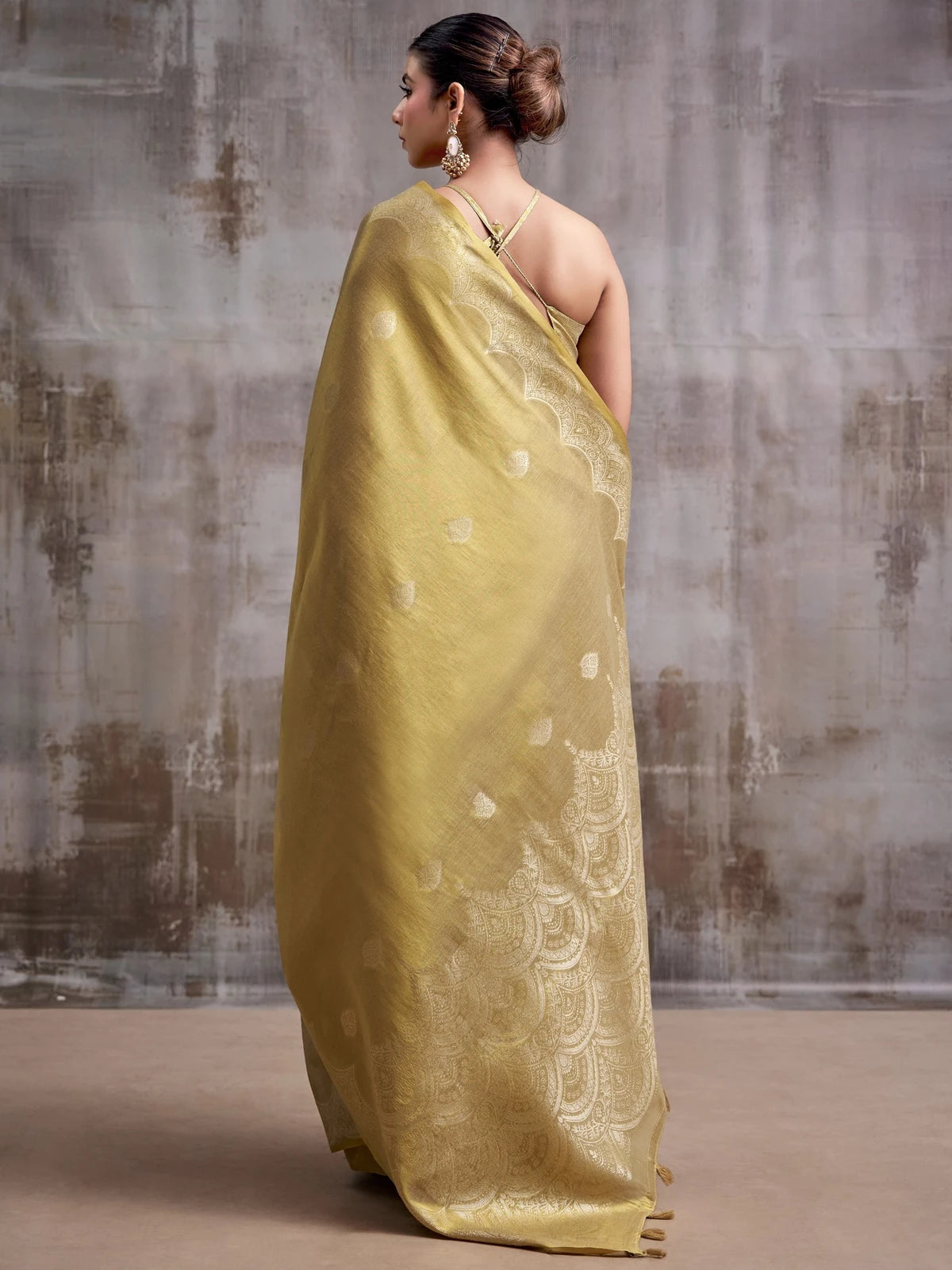Tarani golden tissue silk saree with woven border back view for party festive and wedding wear