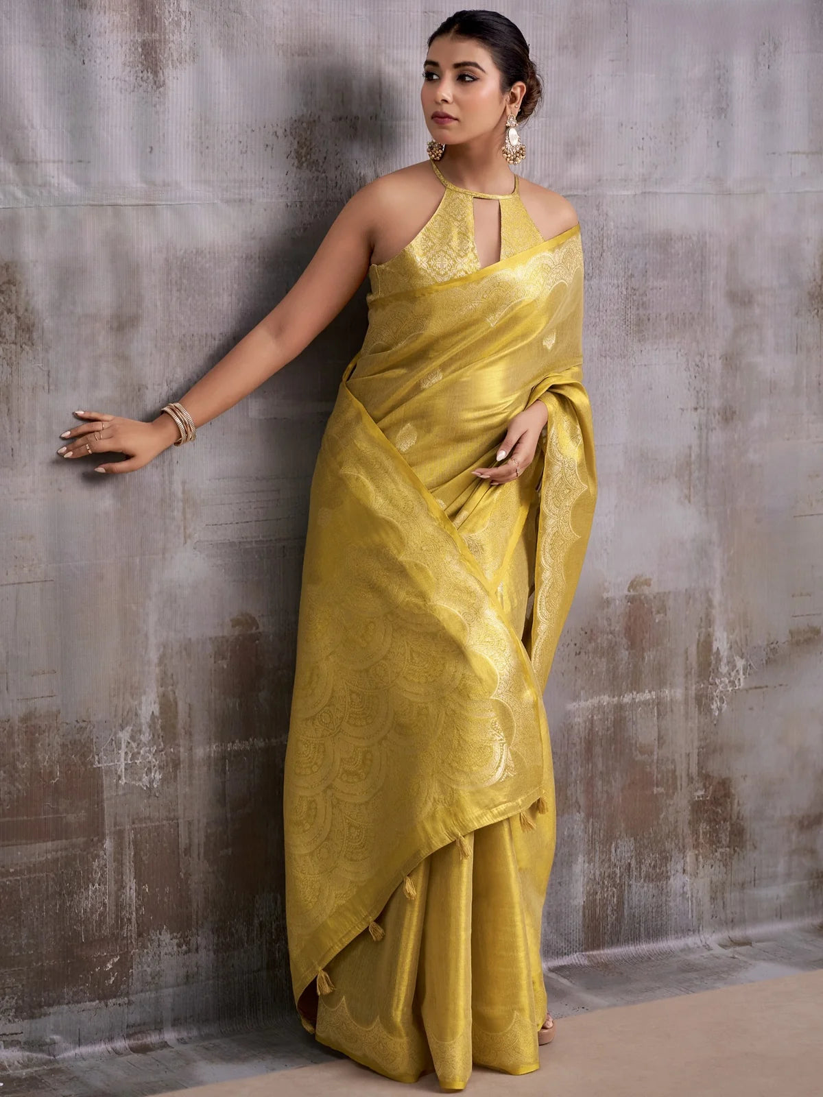 Tarani golden Tissue Silk saree front drape showcasing woven motifs and graceful fall