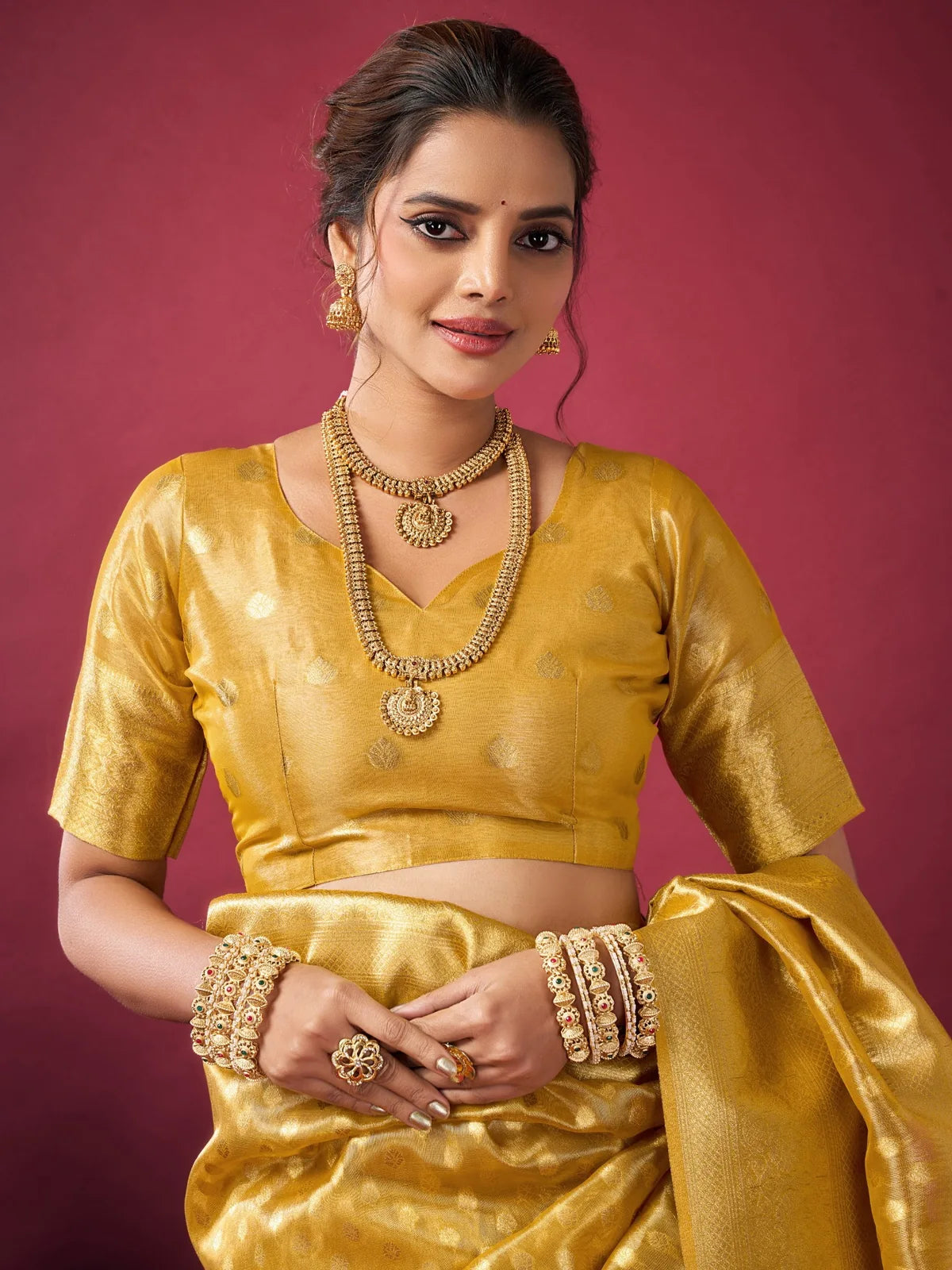 Tarani Rashmika golden Tissue Silk saree upper body view with elegant blouse and woven shine
