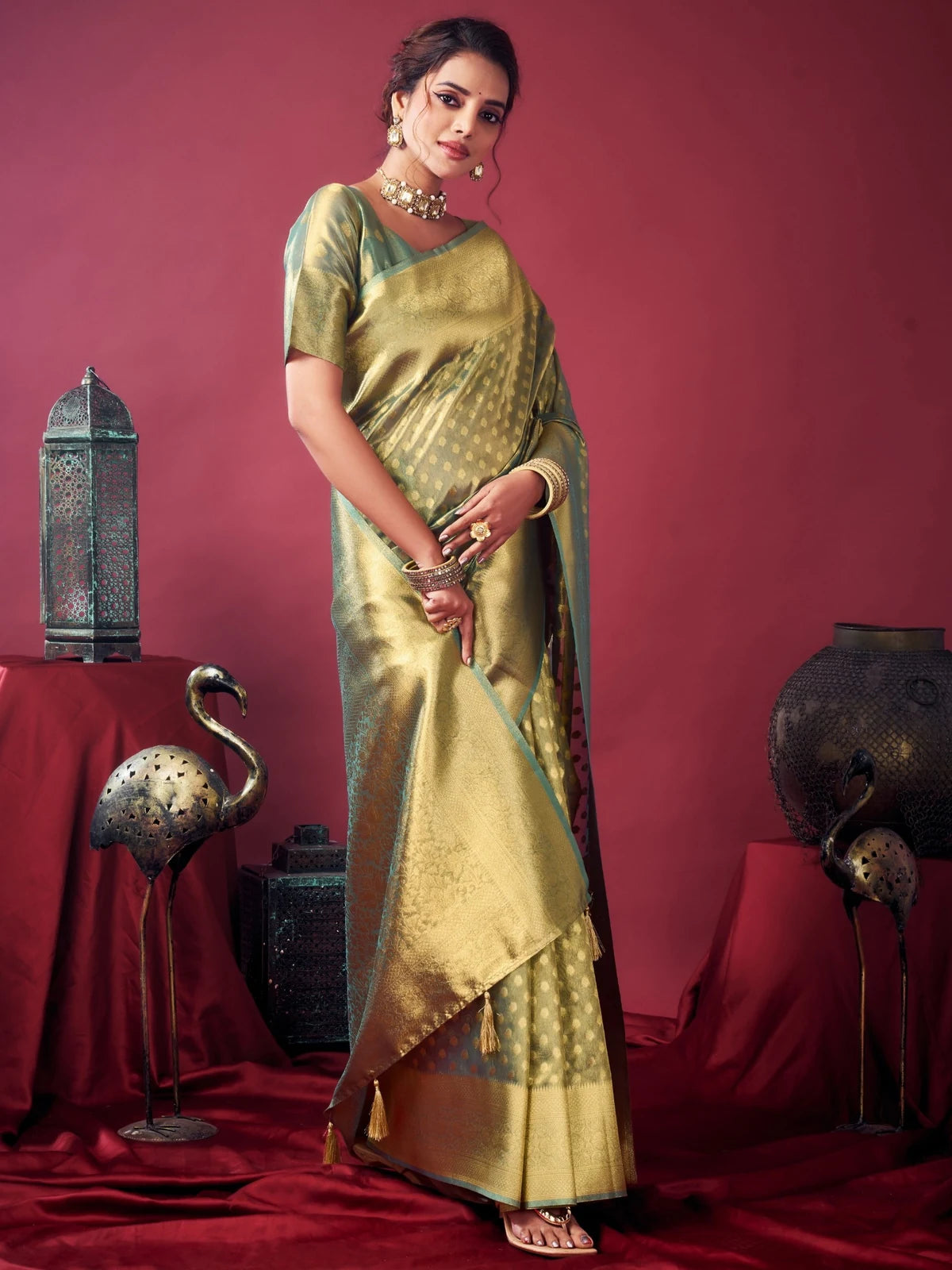 Tarani Dakshina green tissue silk saree front view elegant party wear saree with zhallar