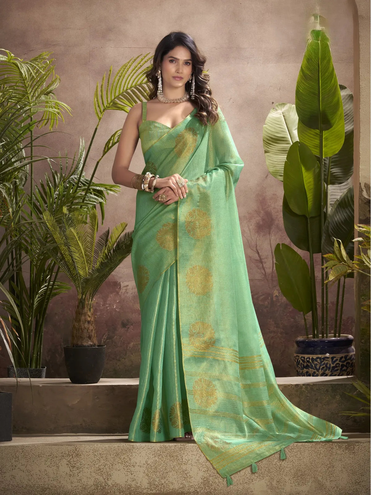 Tarani premium green tissue silk saree with golden woven butta work full view festival wear