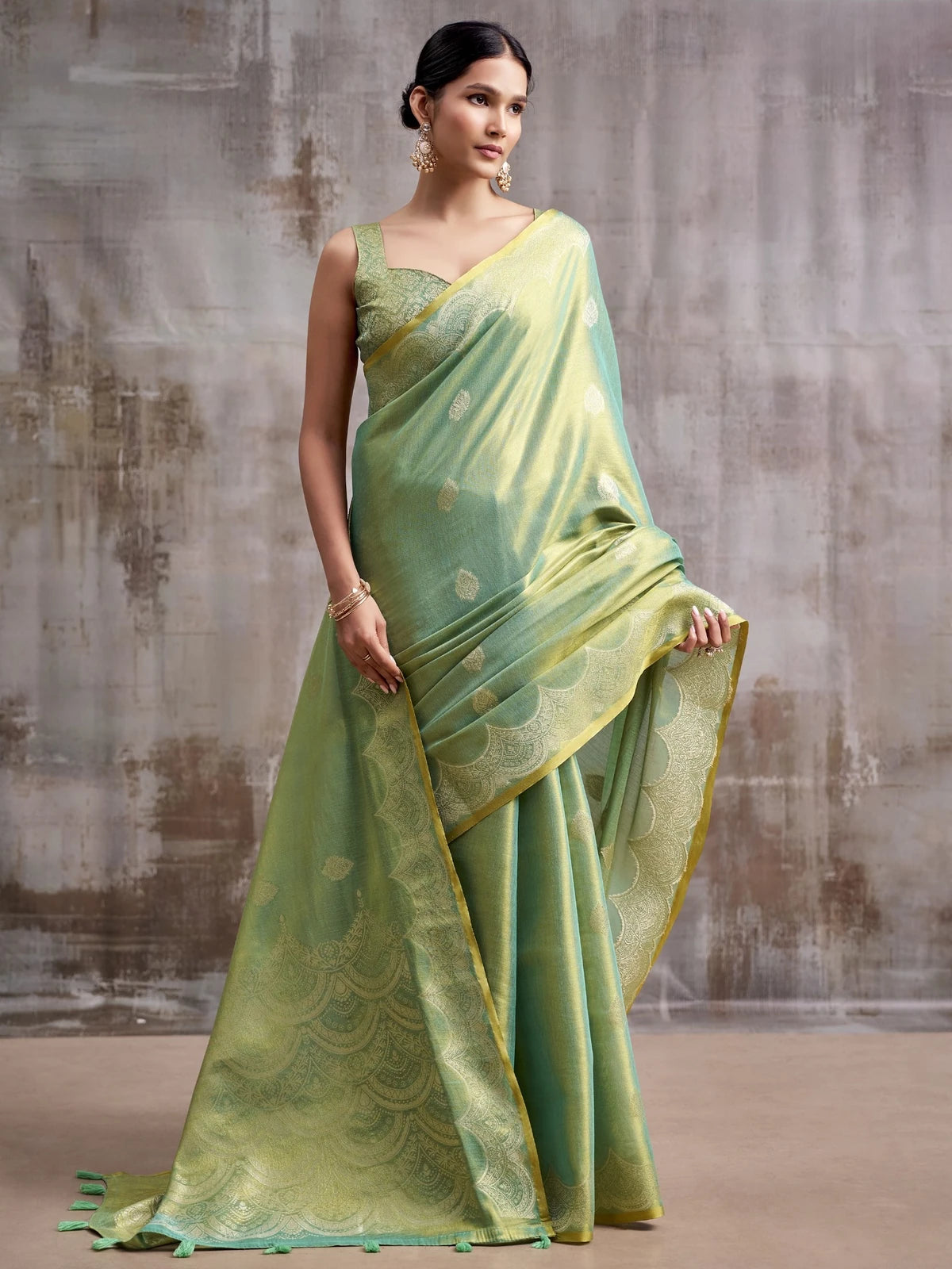 Tarani green tissue silk saree pallu view with woven design