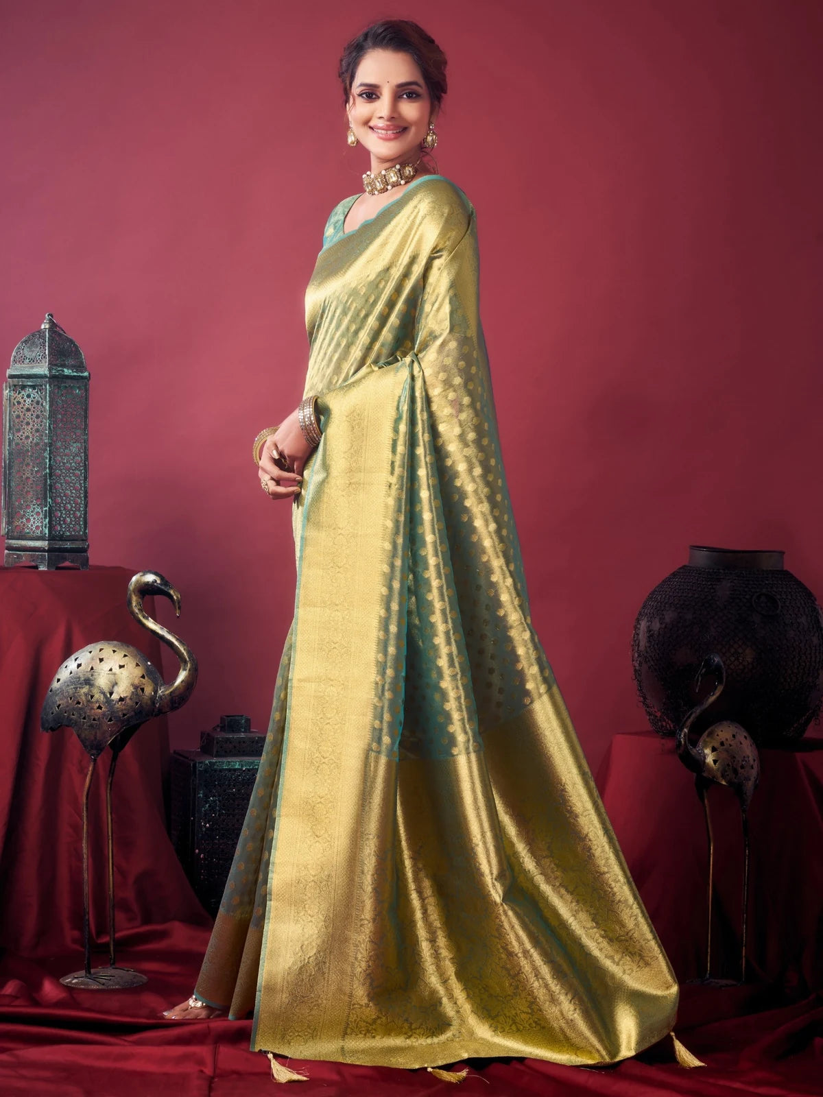Tarani Dakshina green tissue silk saree side view with graceful drape and woven motifs