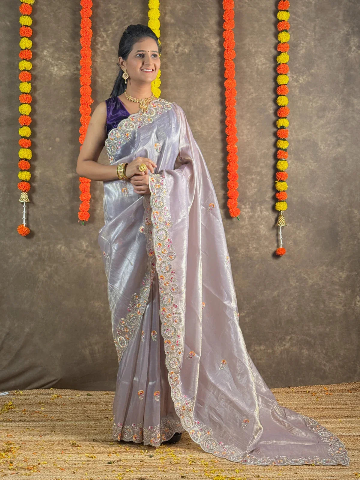 Tarani lavender tissue silk saree full view with floral border and elegant pallu