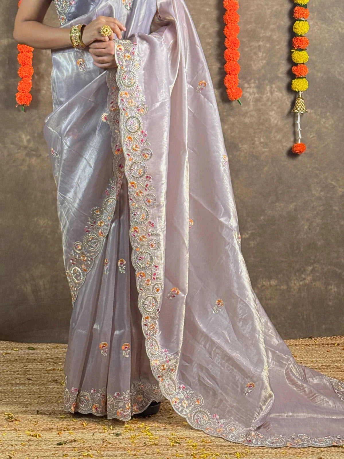 Tarani lavender tissue silk saree pallu view highlighting detailed border embroidery