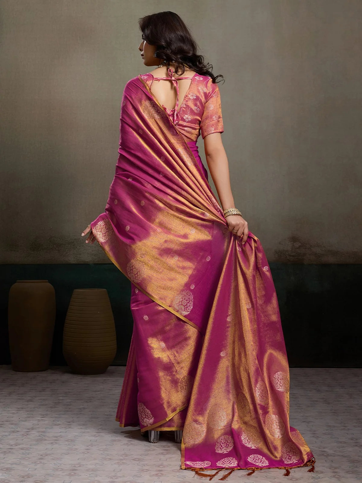 Tarani magenta tissue silk saree back view with graceful drape and blouse back pattern