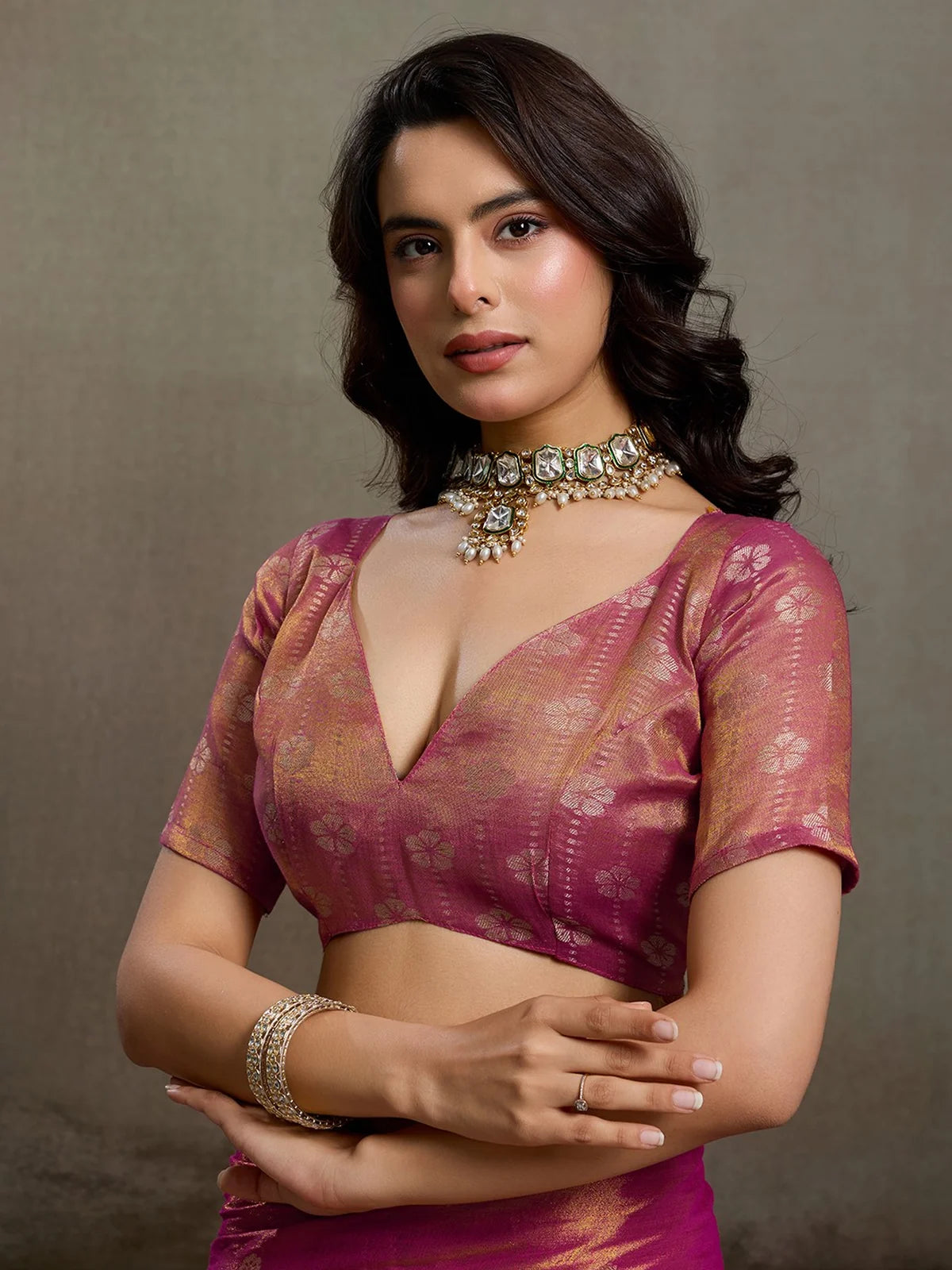 Tarani magenta tissue silk saree upper body view with matching tissue silk blouse and zari detailing