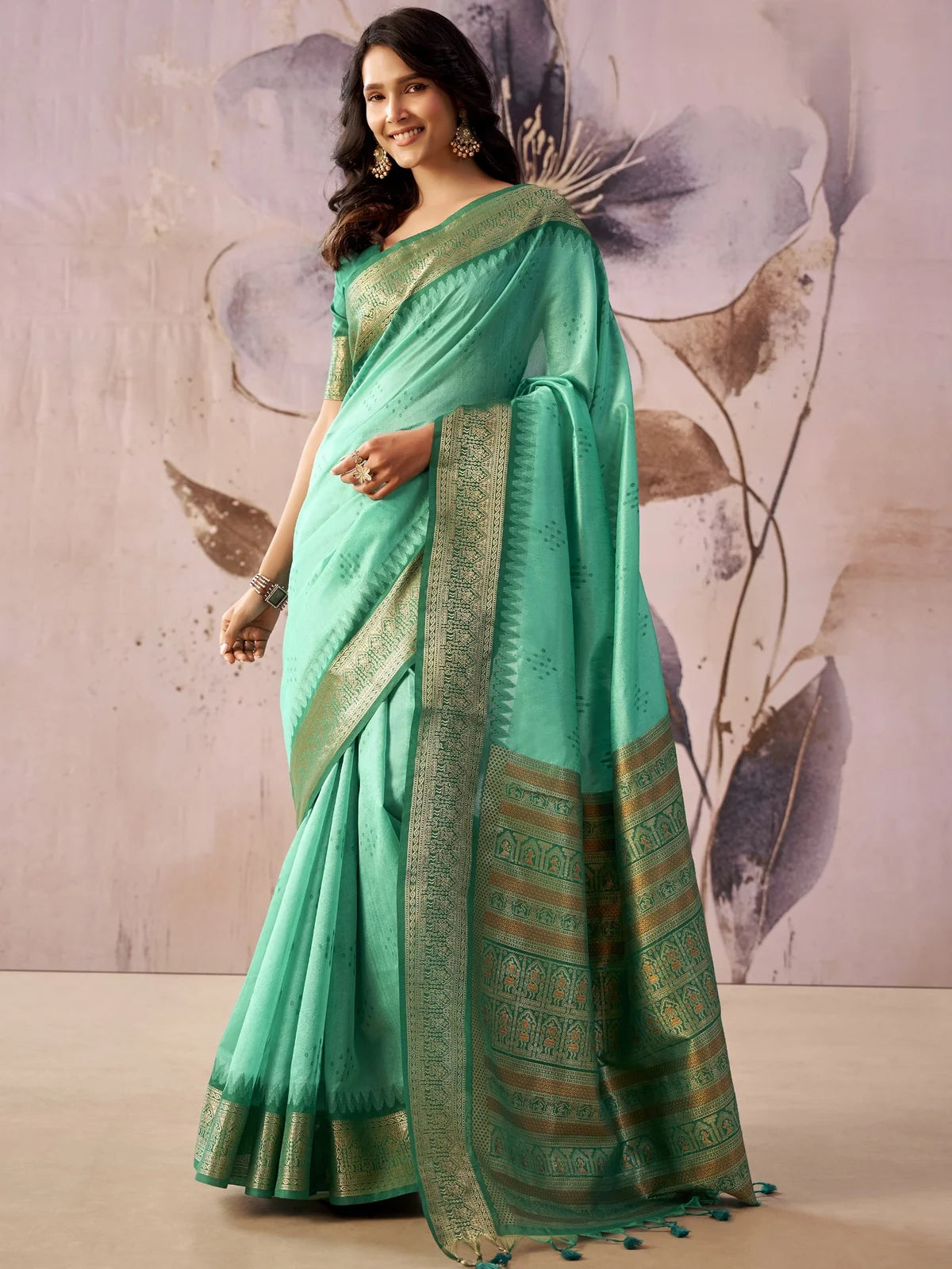 Tarani mint green tissue silk saree with zari weaving border full front view for festive and wedding wear
