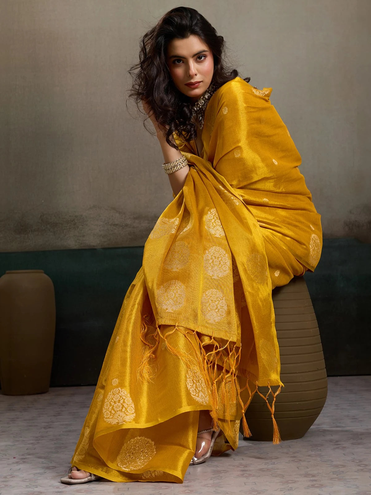 Tarani mustard tissue silk saree Shefali pallu view with woven motifs and blouse