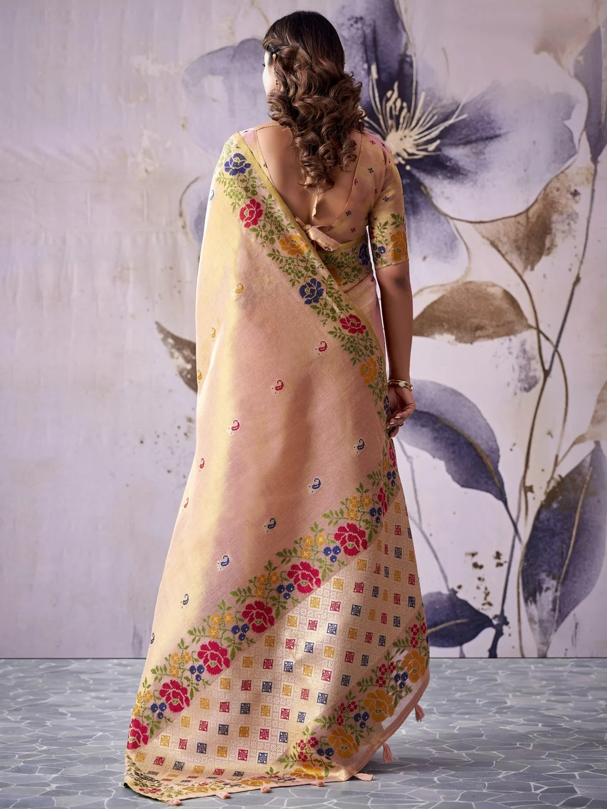 Tarani peach Tissue Silk saree back view displaying decorative pallu