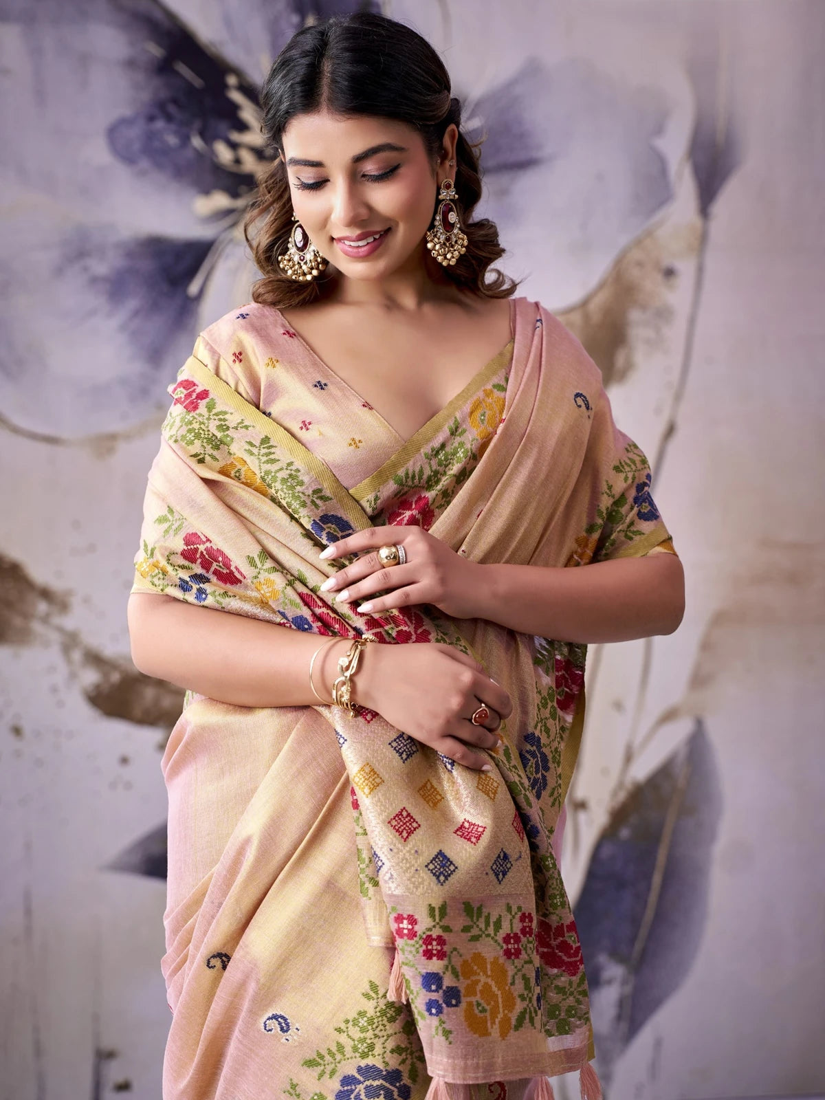 Tarani peach Tissue Silk saree upper body view highlighting woven border