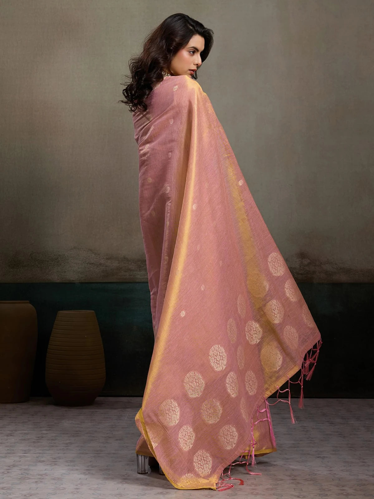 Tarani Indrayani pink tissue silk saree back view with woven motifs and tassel border
