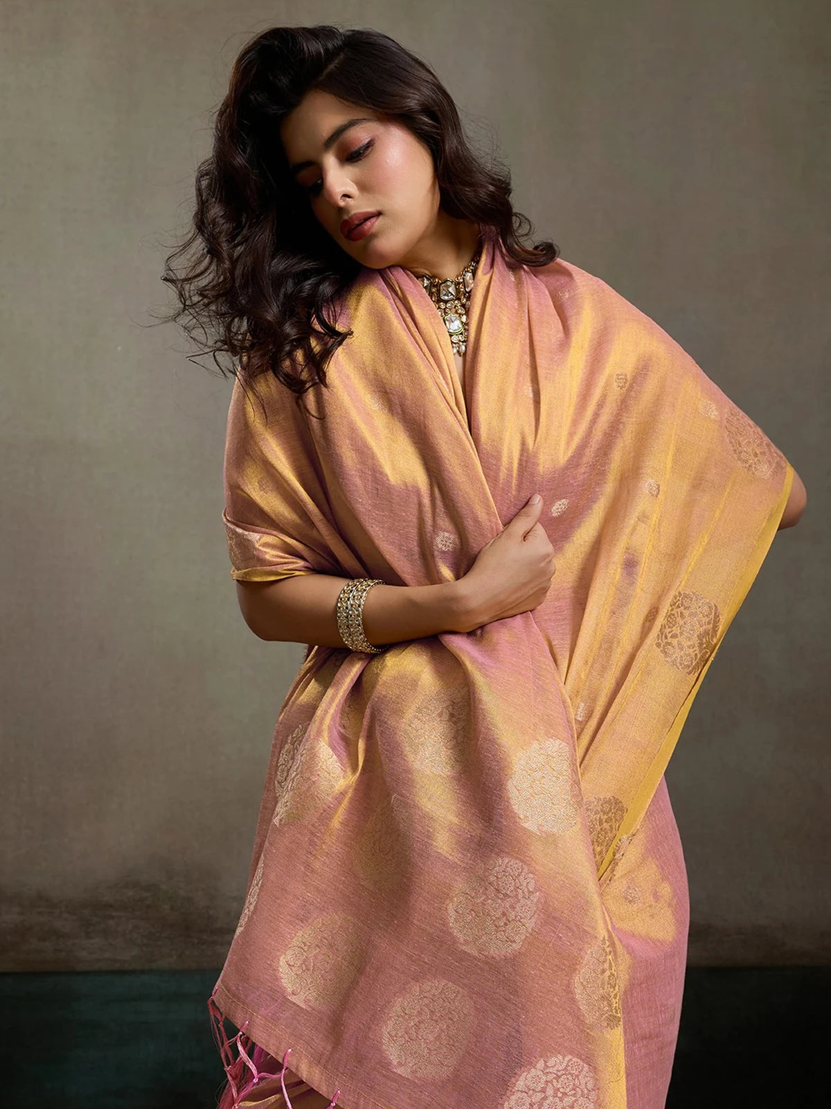 Tarani Indrayani pink tissue silk saree pallu view with tassels and golden woven circles