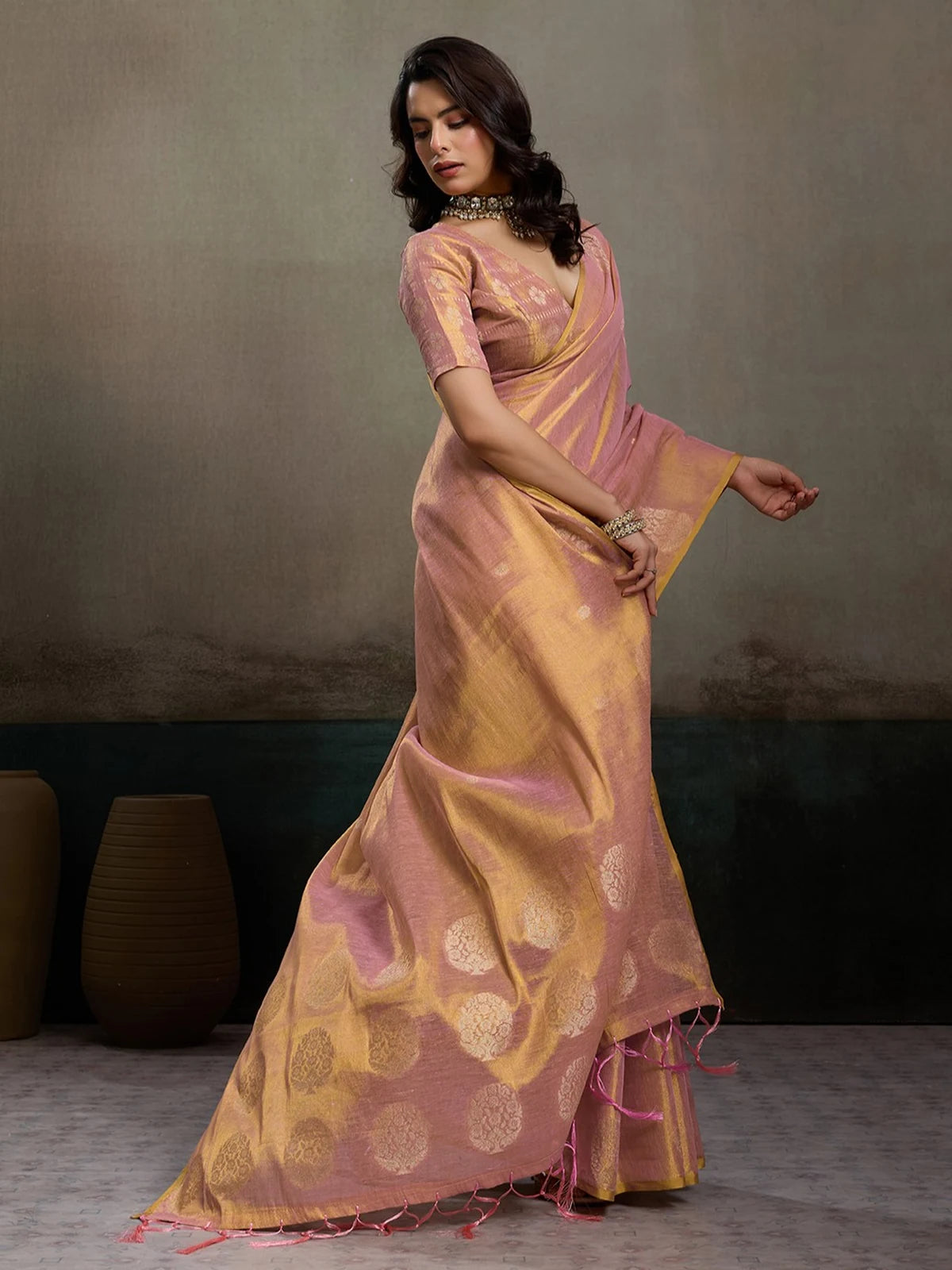 Tarani Indrayani pink tissue silk saree side view with graceful drape and festive elegance
