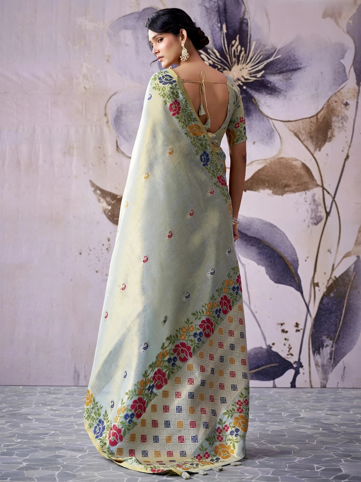 Tarani tissue silk saree in soft sage green floral woven back view