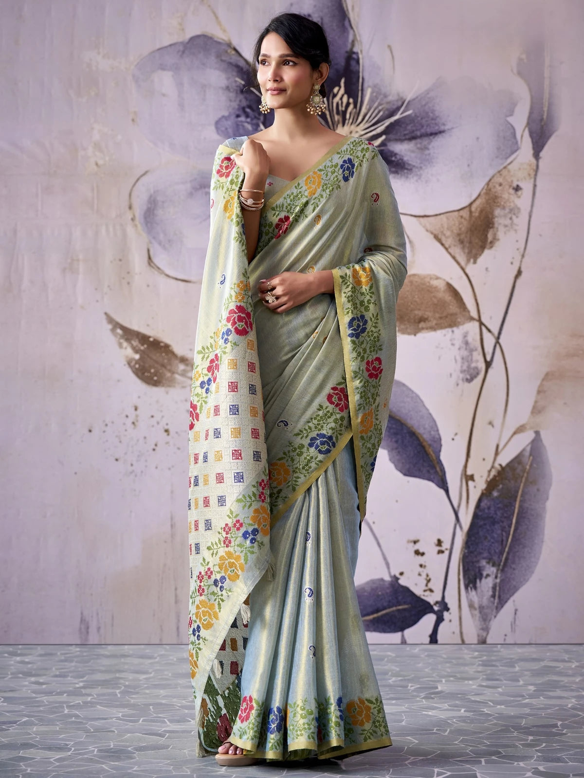 Tarani tissue silk saree in soft sage green floral woven front view