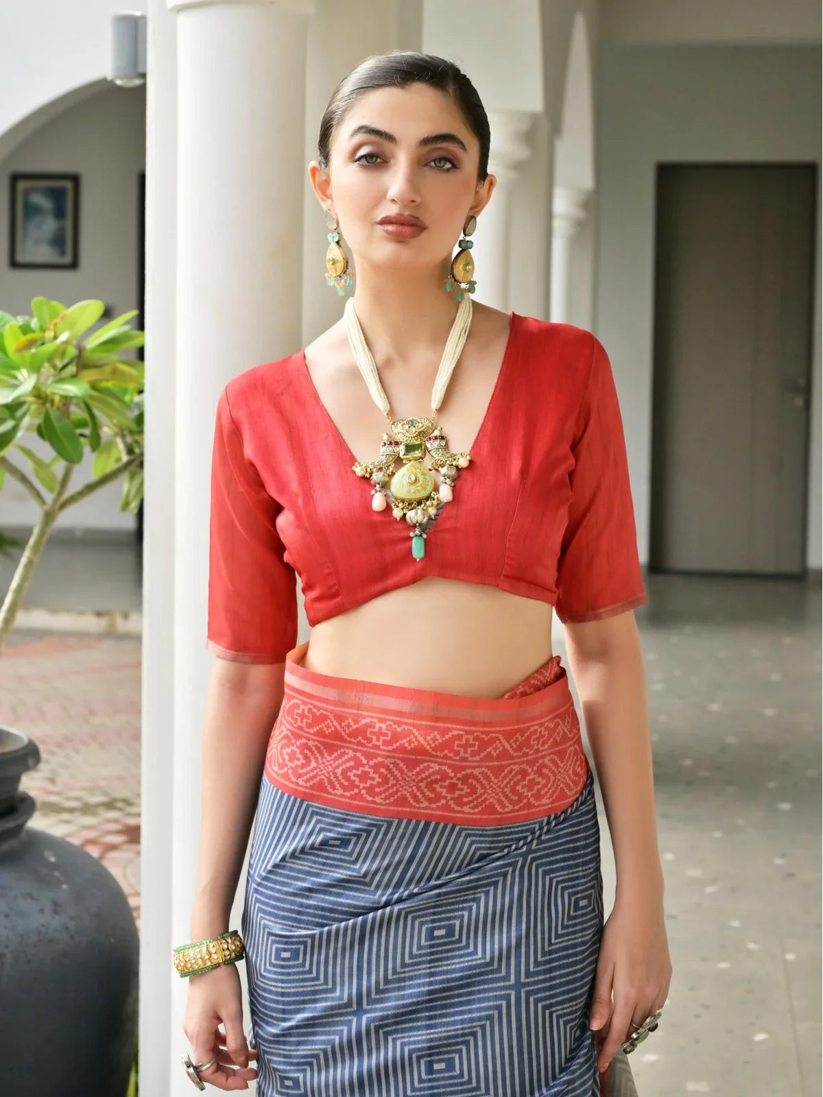 Tarani premium tussar silk saree – upper body view showing red blouse