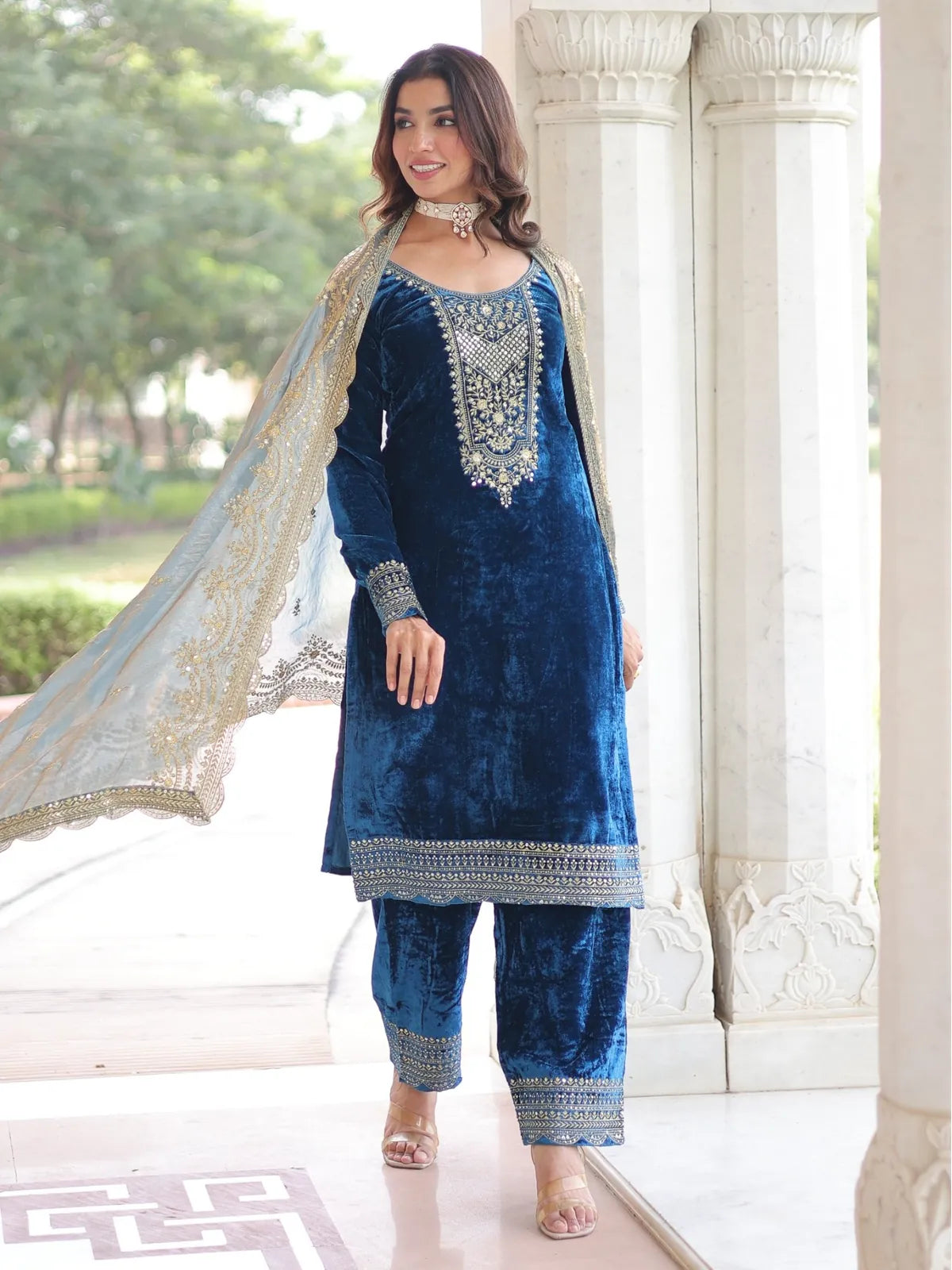 Tarani front view of blue velvet embroidered dress with matching palazzo and dupatta