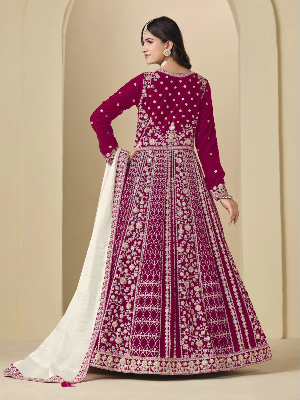 Back view of Tarani maroon velvet dress with full embroidery and stylish dupatta flow