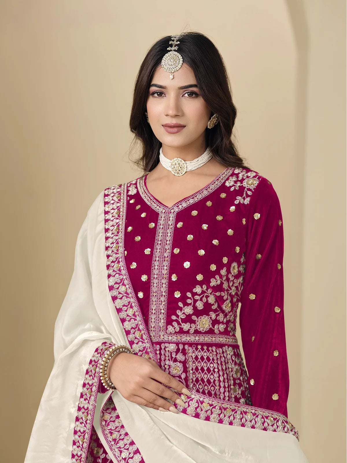 Tarani velvet dress in maroon with detailed bodice embroidery and elegant choker styling