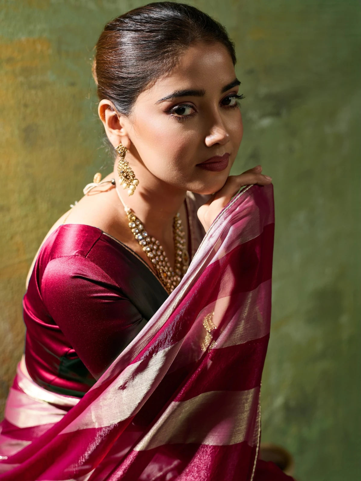 Tarani maroon velvet satin saree closeup with metallic gold patta and blouse detailing