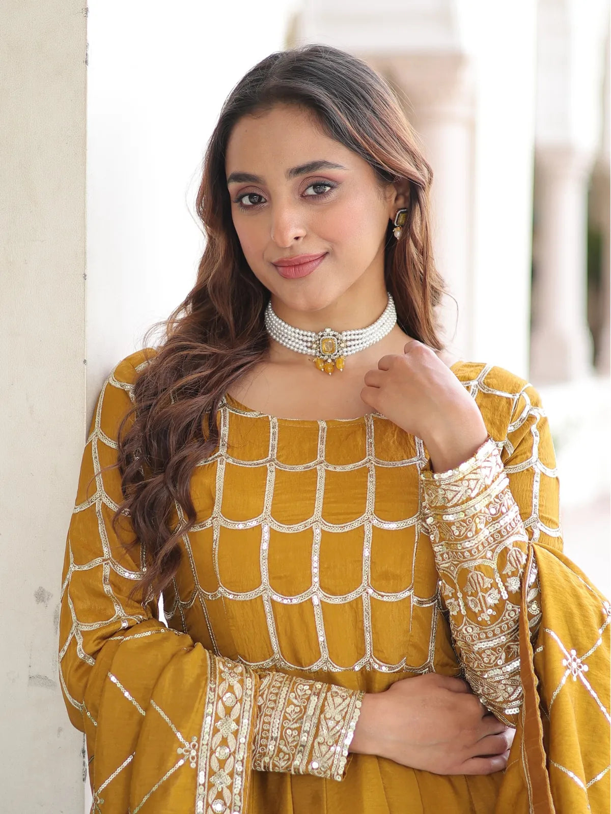 Tarani mustard gown in vichitra fabric showing detailed embroidery on upper body