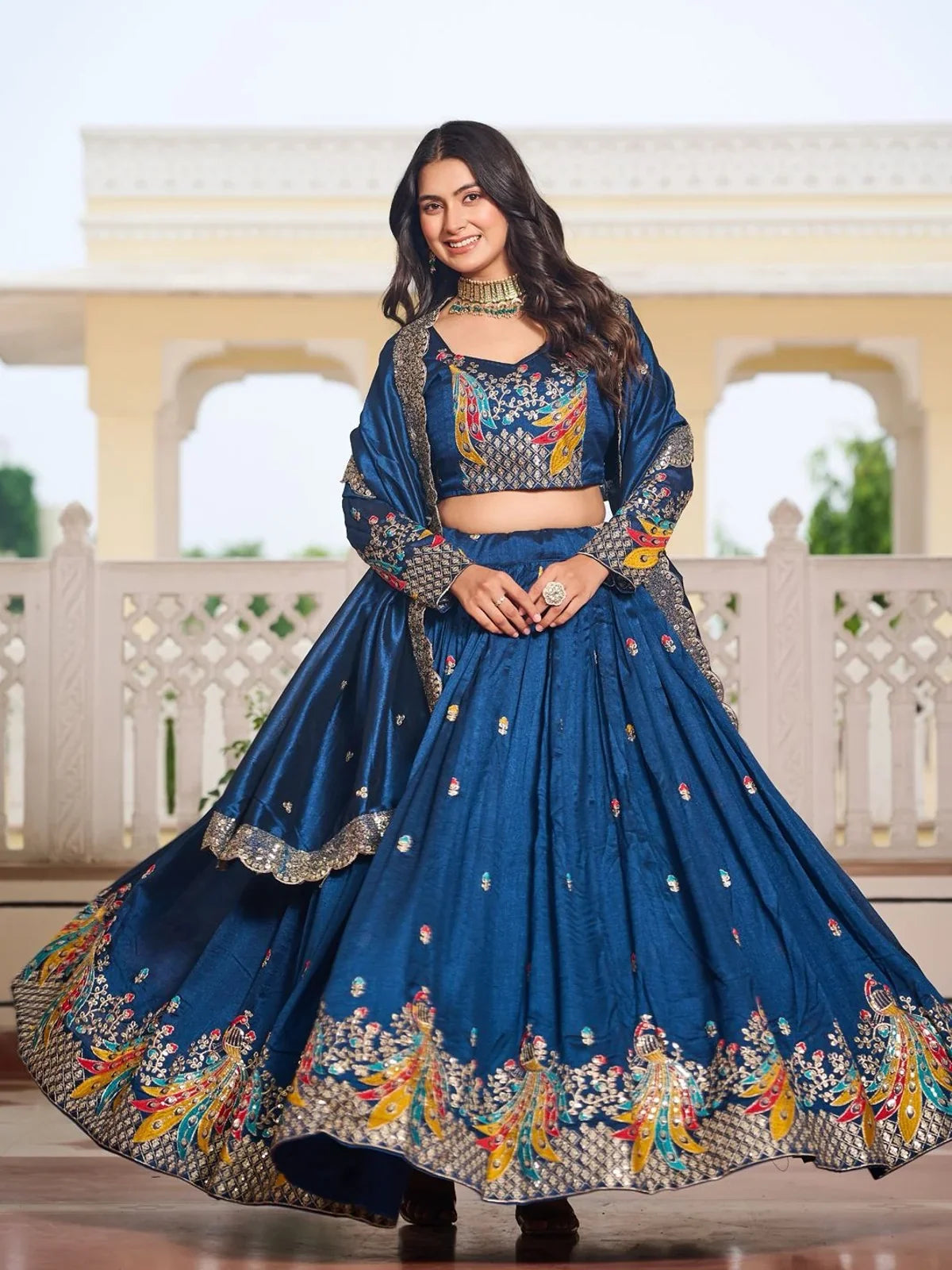 Tarani embroidered vichitra lehenga in blue with choli and dupatta front-facing pose