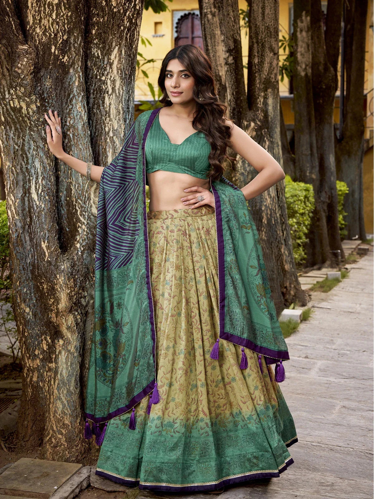 Tarani green printed Vichitra silk lehenga with canvas stitching and striped blouse for festive occasions