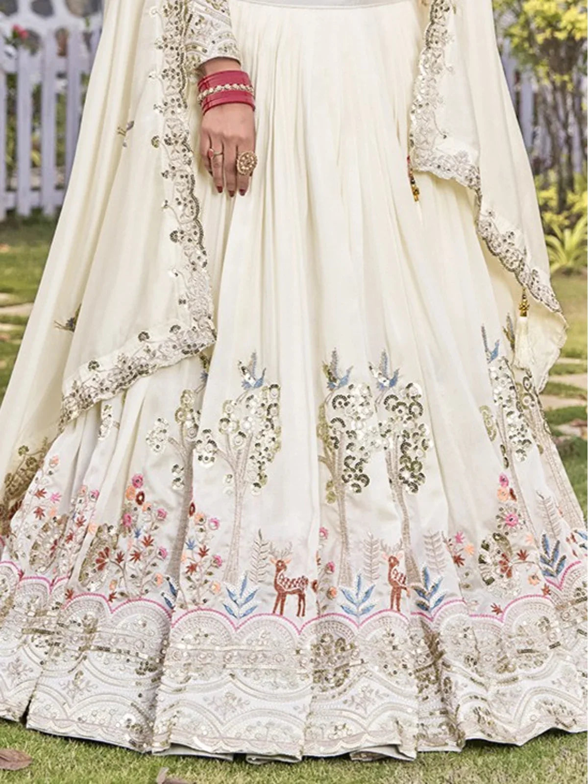 Tarani lehenga bottom border view in offwhite with animal motifs and sequin thread embroidery