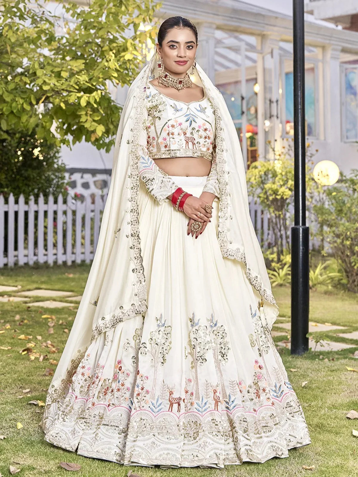 Tarani offwhite Vichitra lehenga with heavy embroidery and matching choli dupatta for festive events