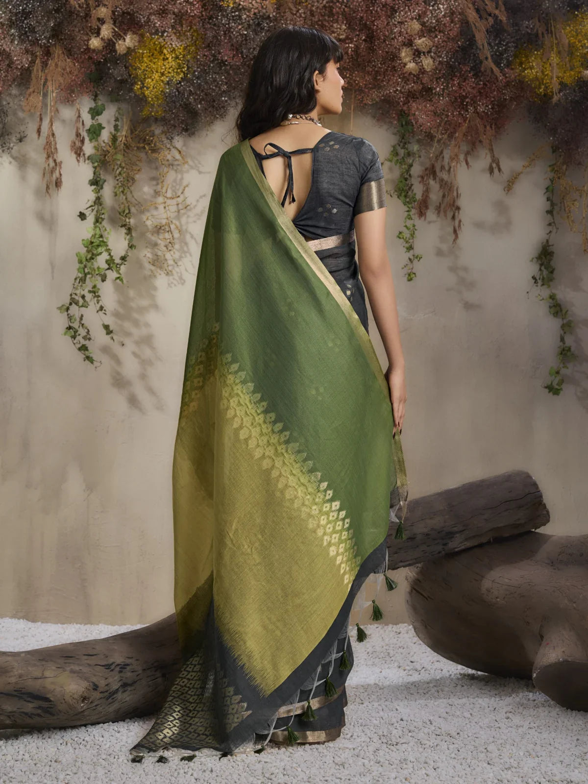 Tarani saree back view showing full green pallu with diamond weave and tassel detailing