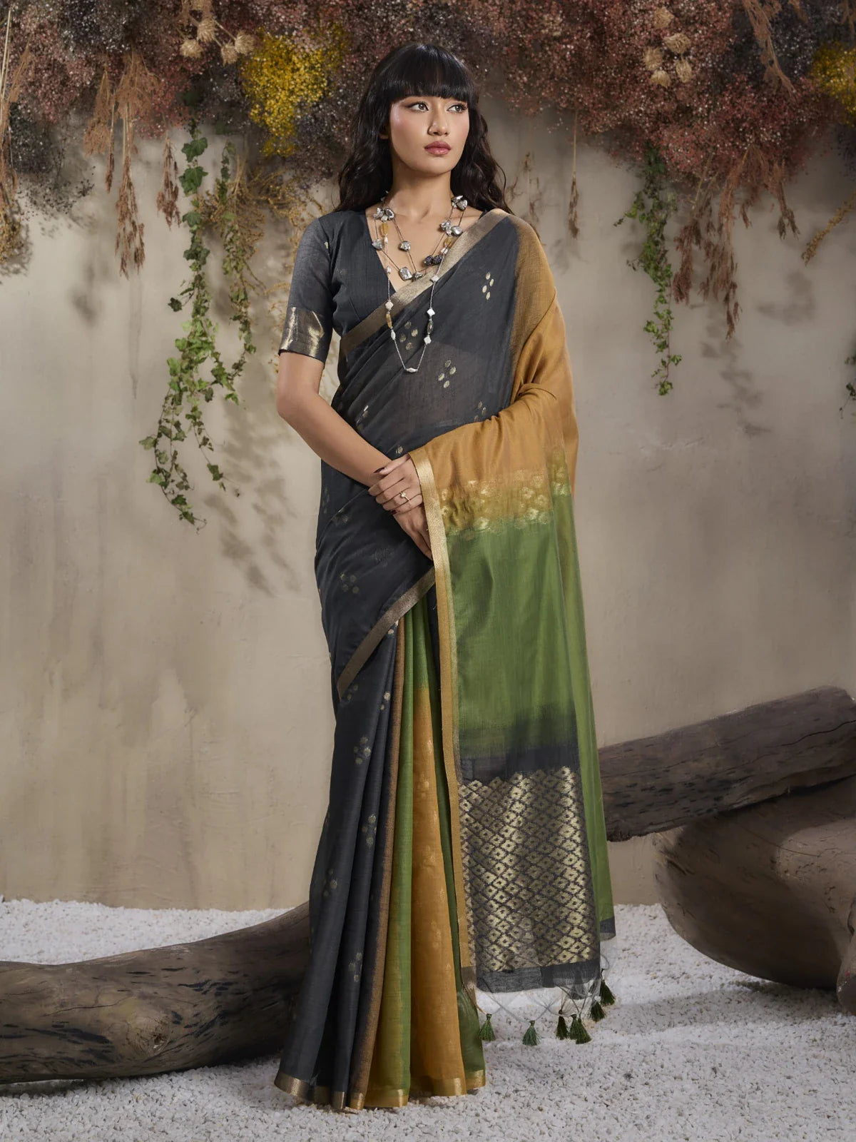 Tarani green viscose cotton saree with golden motifs in full view worn for festive party