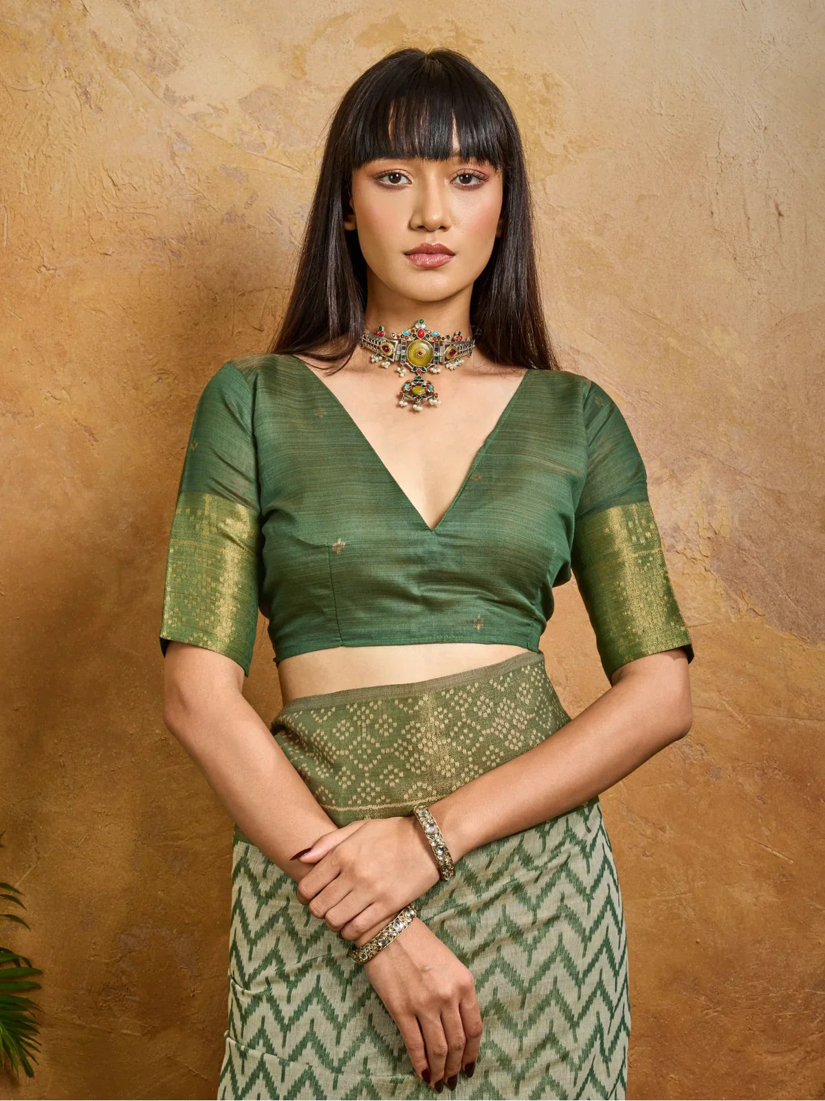 Tarani handloom saree in green with close view of blouse and neckline design, upper body view