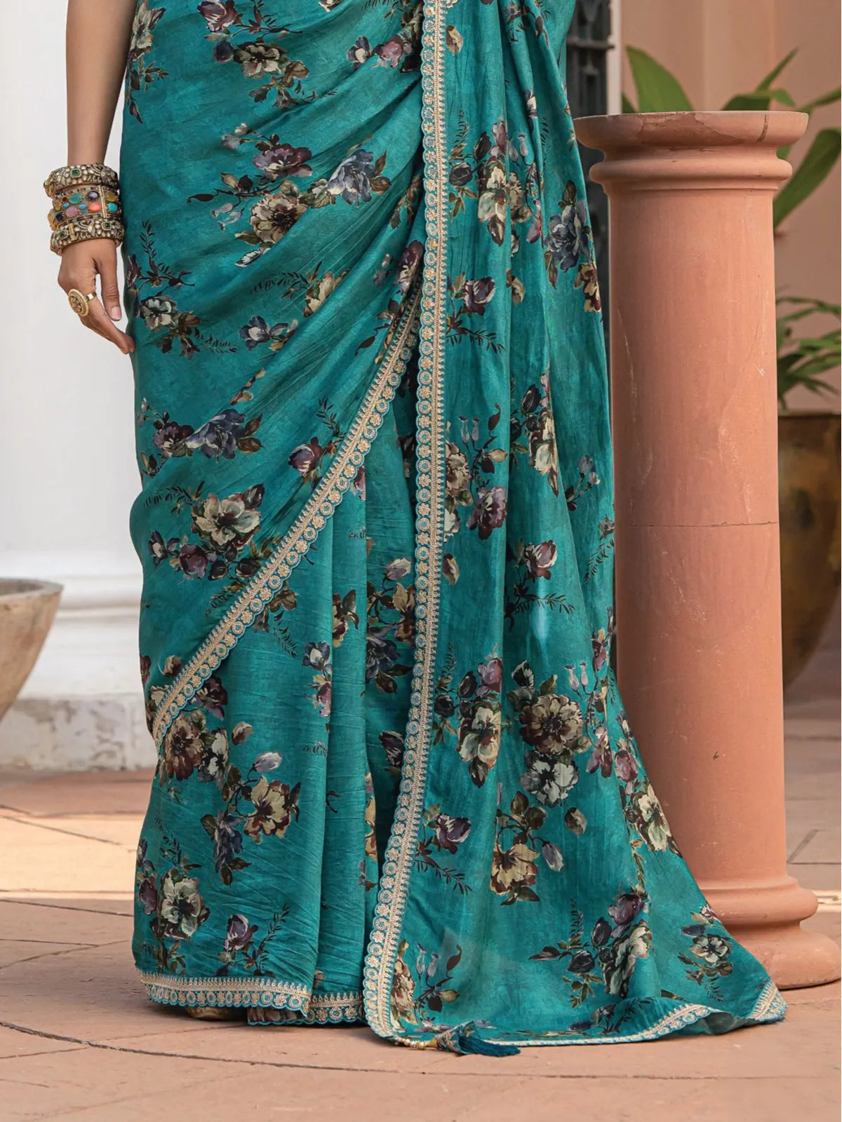 Tarani green viscose dola silk saree closeup view showing floral fabric detailing