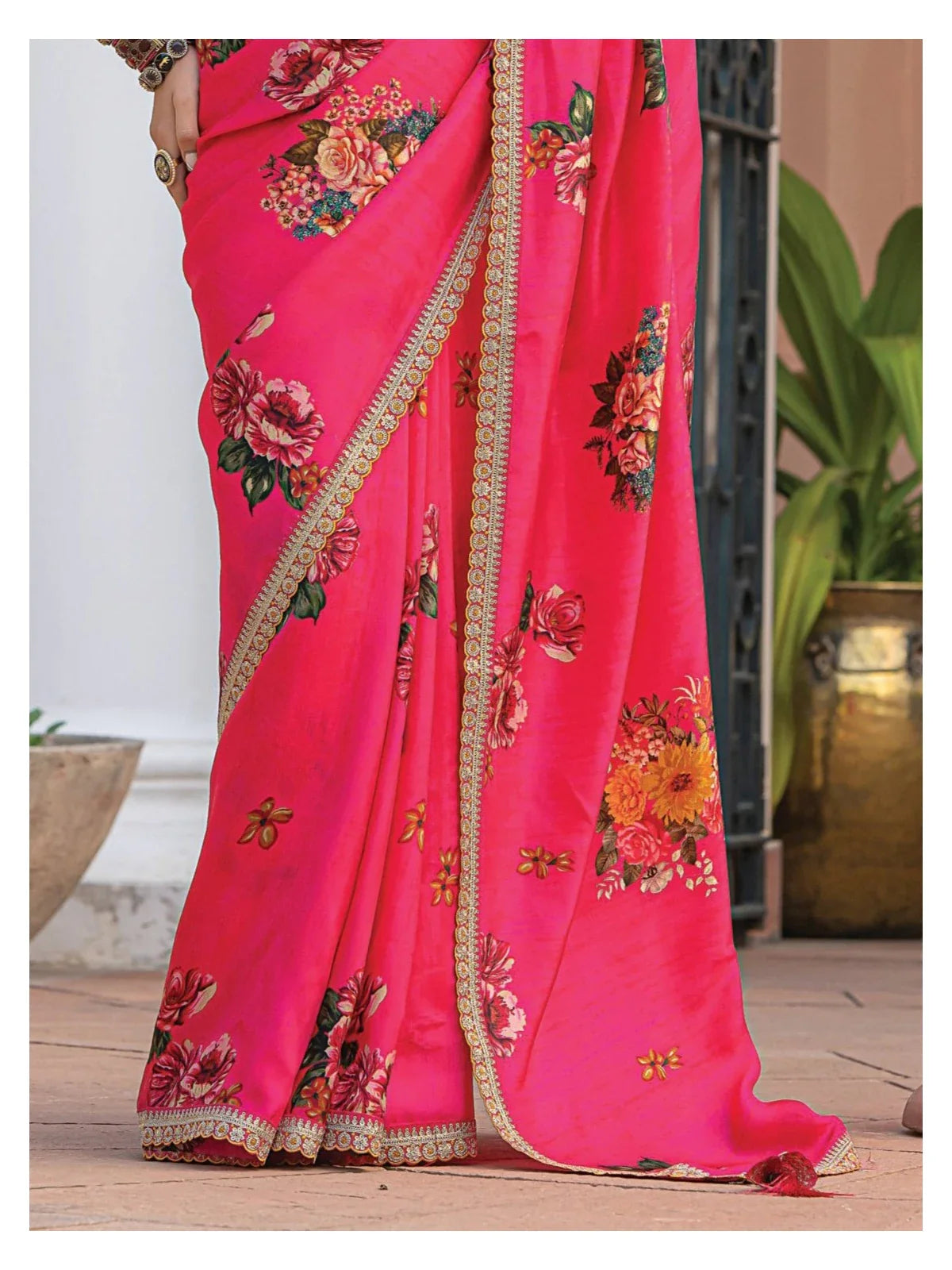 Tarani closeup of pink floral viscose dola silk saree border with floral print detailing