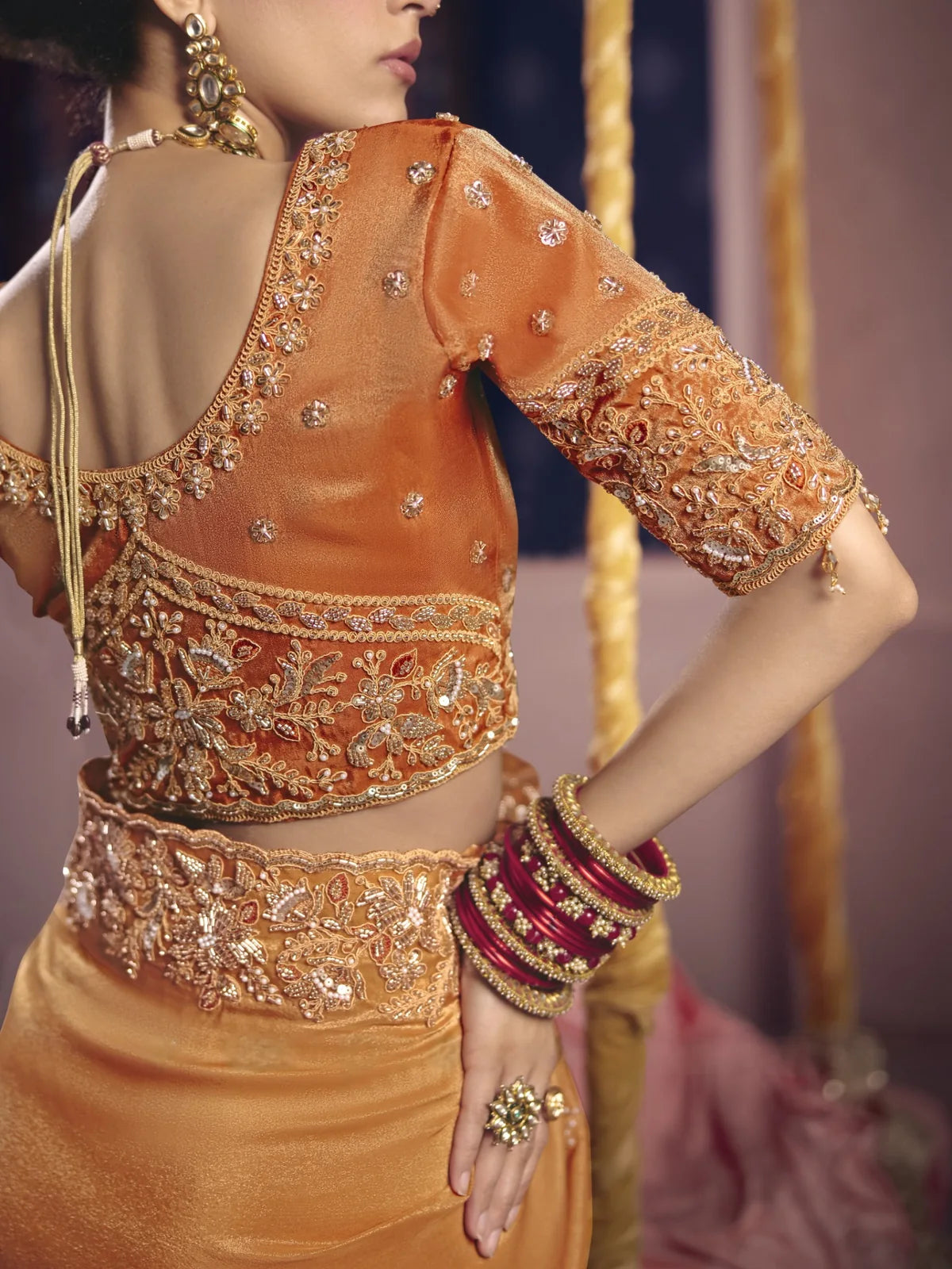 Tarani blouse back design with heavy embroidery and bead work on golden saree by Tarani Nimrita