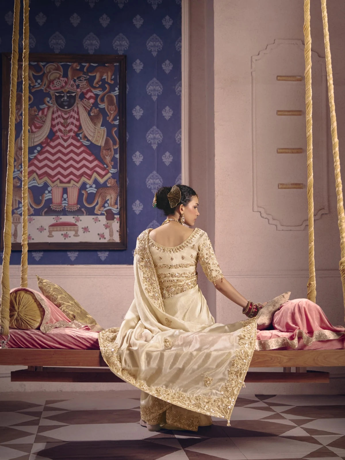 Tarani off white Viscose Zari Tissue Silk saree back view with heavy embroidered blouse and elegant drape